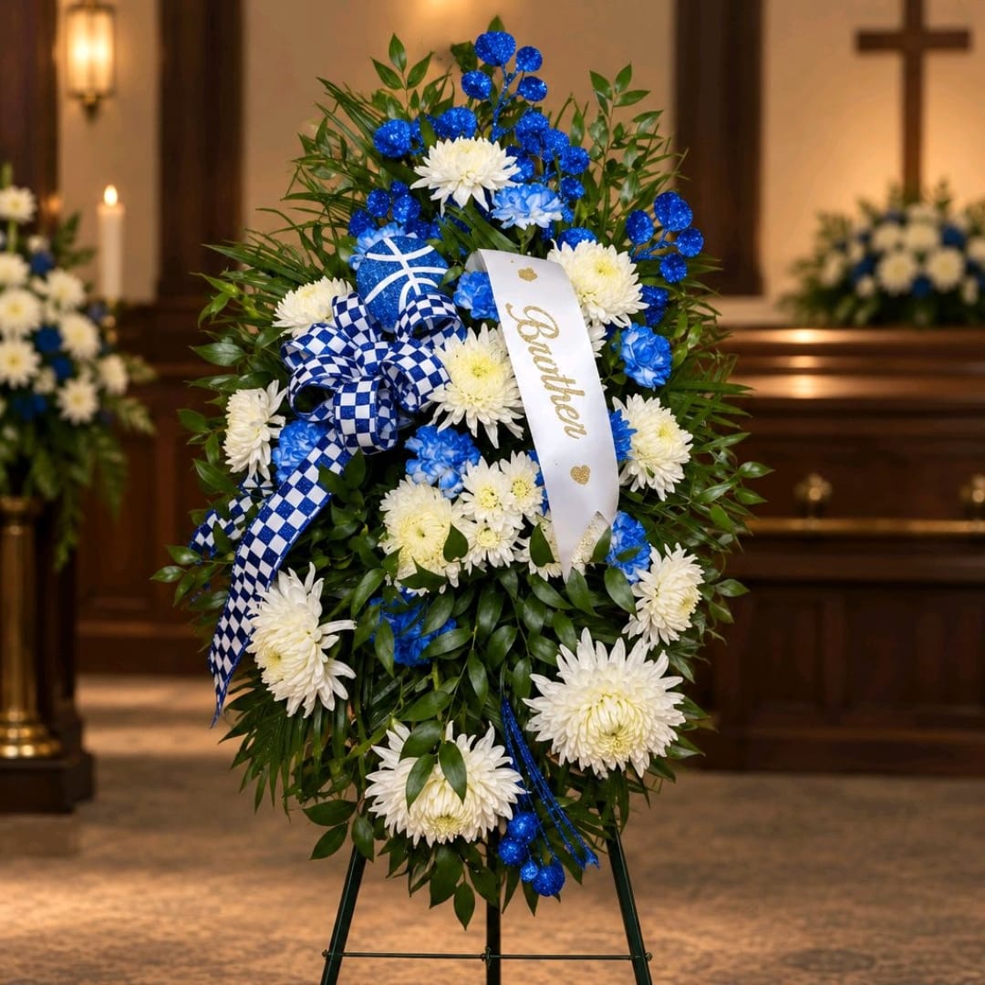 Blue and white funeral wreath with ribbon on an easel