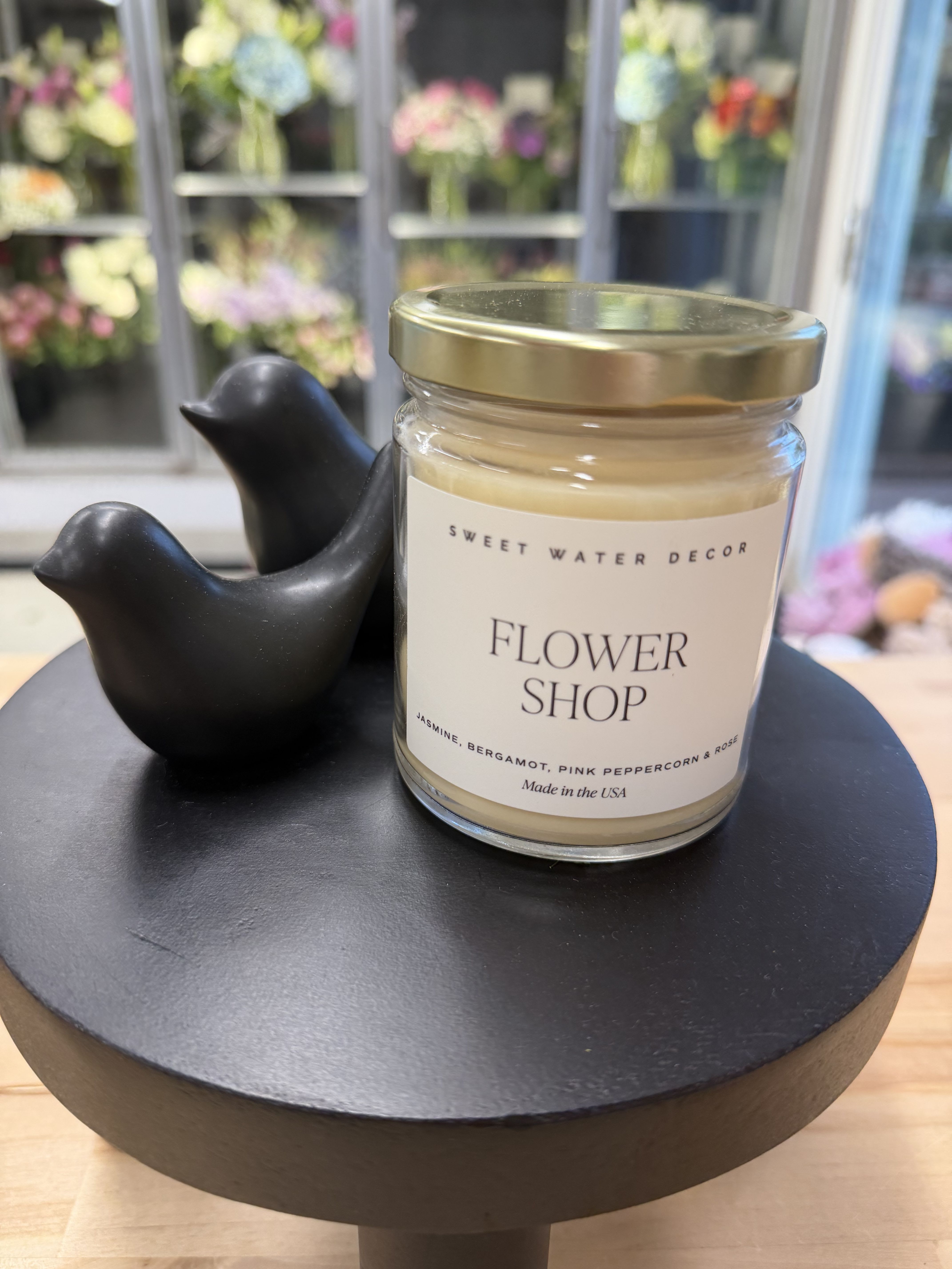 Candle - Flower Shop - Bring the essence of a fresh Flower Shop to your customers. This bold, floral-forward candle layers rich, true-to-nature fragrance with a clean, even burn your shoppers can trust. Thoughtfully crafted to evoke the beauty of fresh blooms, it’s a standout addition to any spring or everyday assortment.