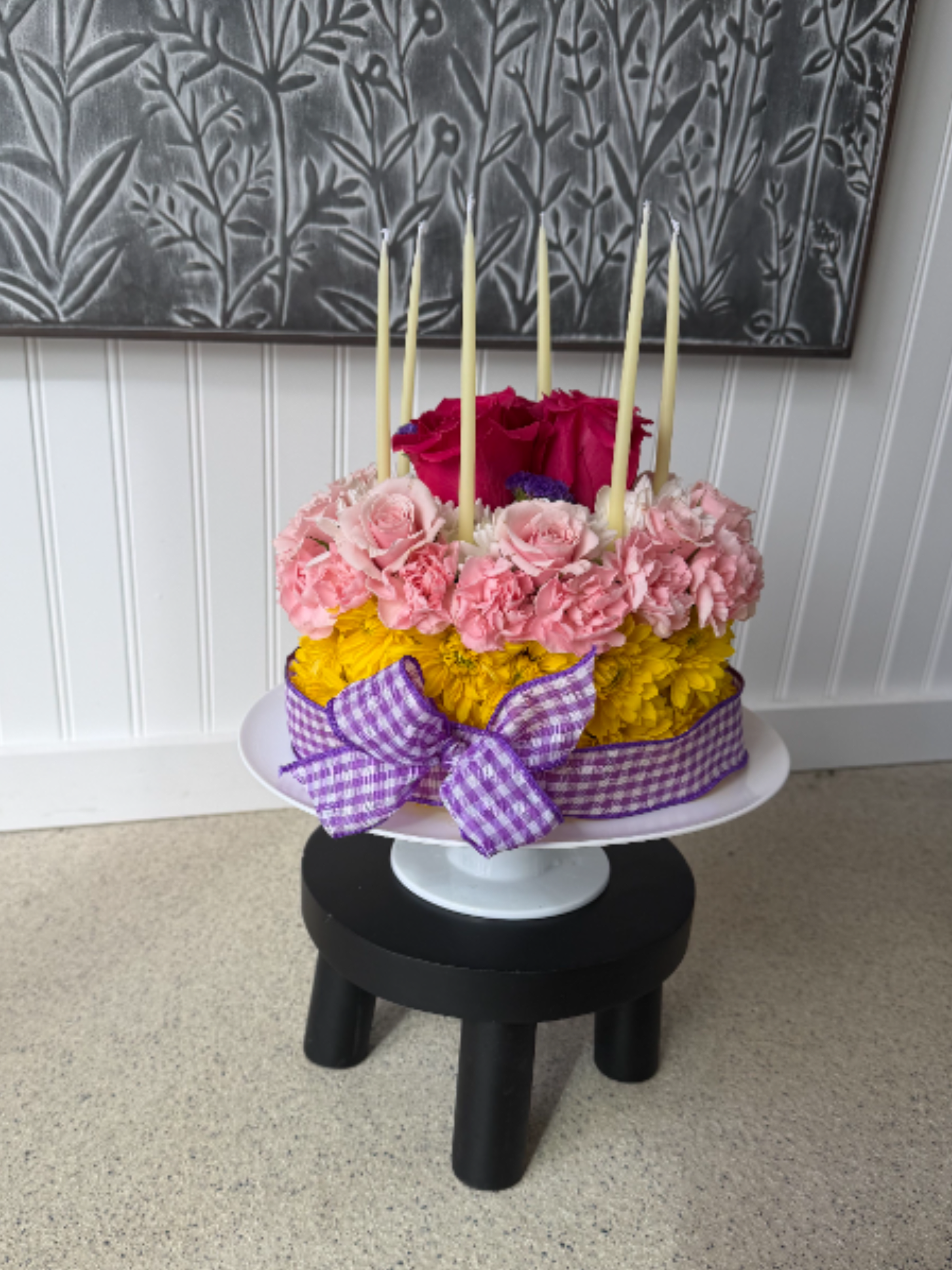 Floral Birthday Cake - This beautiful floral birthday cake is sure to make your special someone smile.  This cake is decorated with a variety of colorful blooms, wrapped in a ribbon, and topped with birthday candles, of course. Please note color preferences.   A 48-hour notice is required for this floral design.