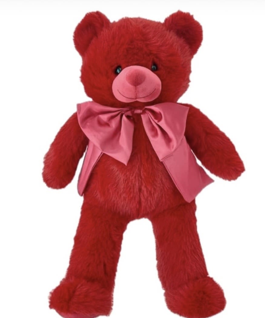 Red teddy bear with a pink satin bow