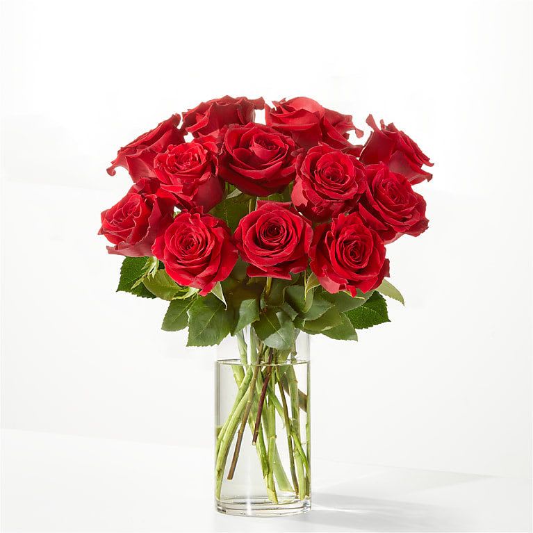 Bouquet of red roses in a clear glass vase