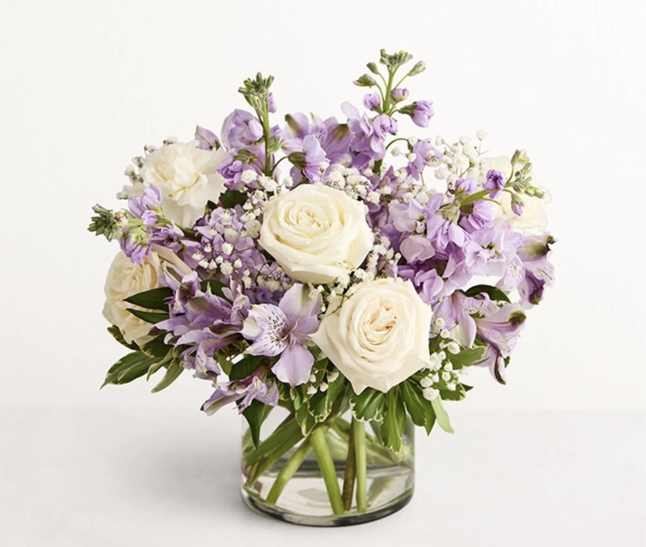 Lavender and white bouquet in a clear glass vase