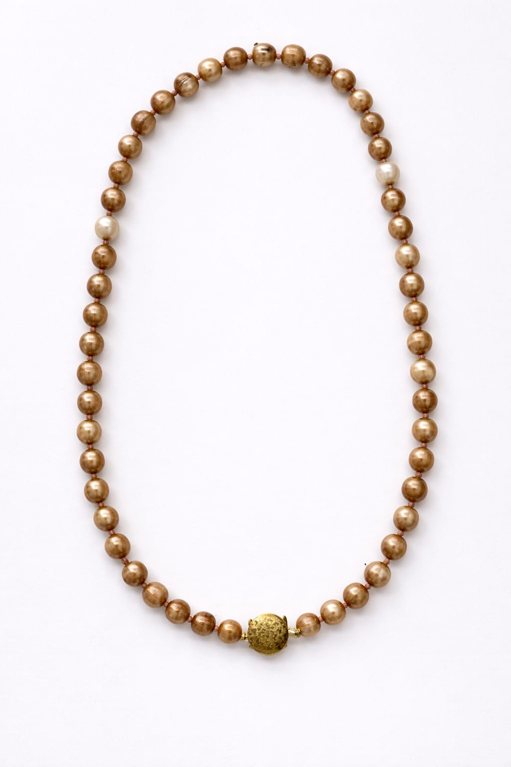 Gold beaded necklace on a white background
