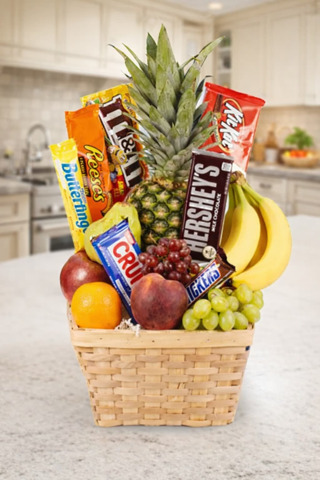 Fruit basket with candy bars and bananas in a woven basket