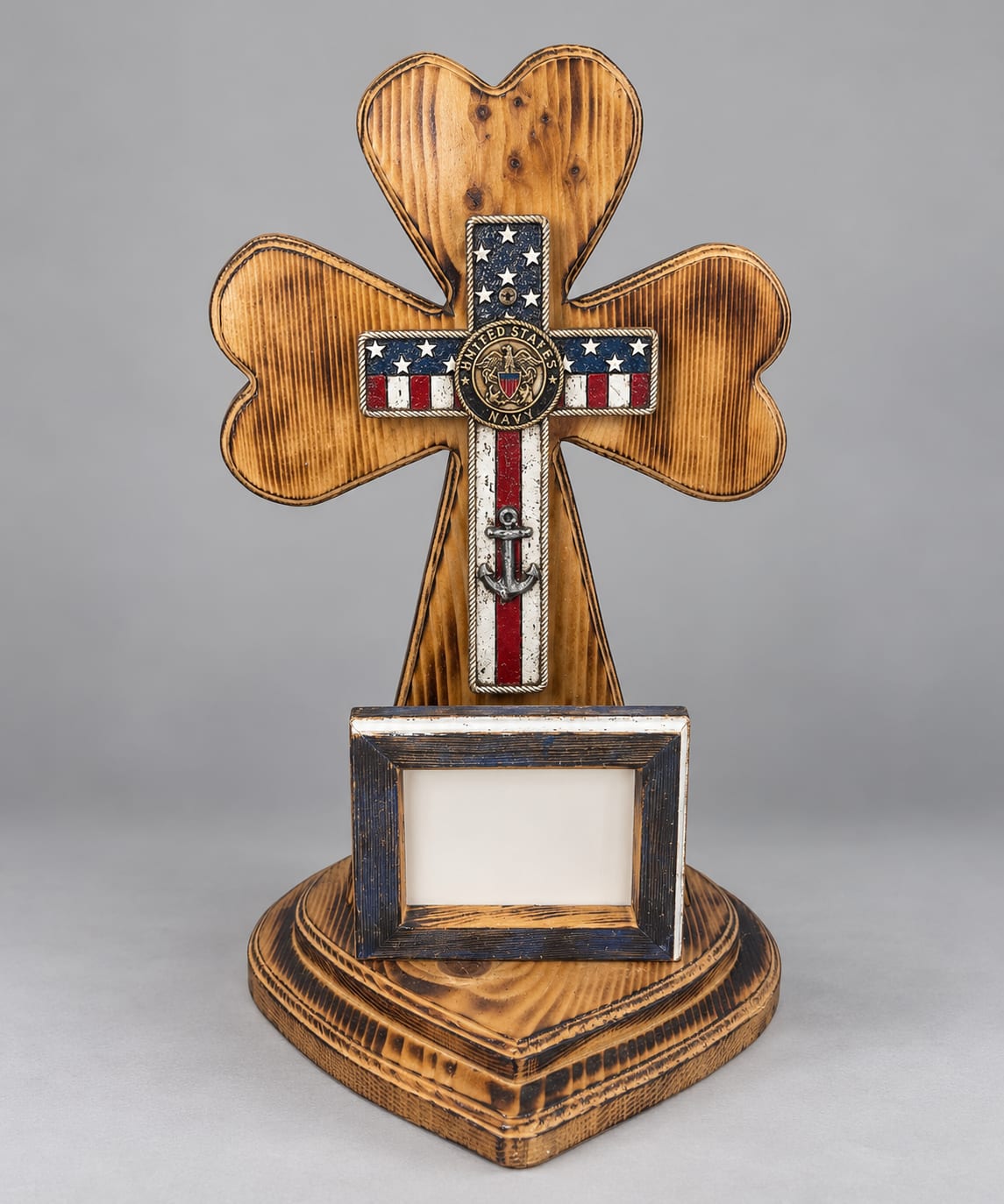 Wooden cross-shaped memorial display with a small photo frame
