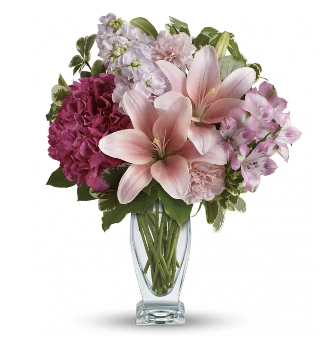 Her Love - This Beautiful mix of fragrant lilies and lush hydrangea in dreamy shades of pink. Presented in a glass vase, this beautiful bouquet is affection perfection! Includes pink hydrangea, asiatic lilies, alstroemeria, carnations and stock, accented with fresh greens. 