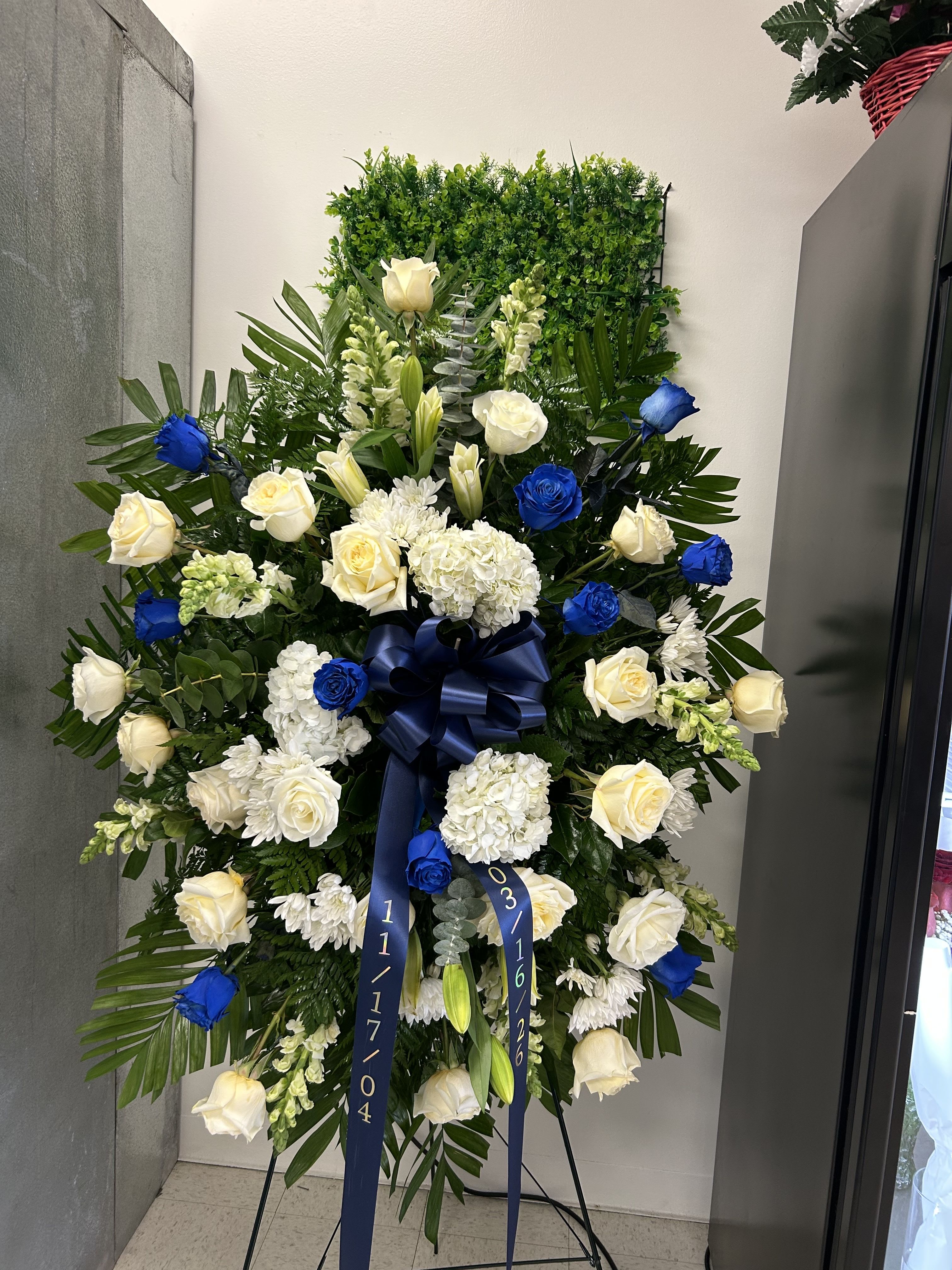 Blue funeral spray - Blue funeral arrangement. A total of 24 roses are in this arrangement, White and blue roses. 12 BLUE 12 WHITE 