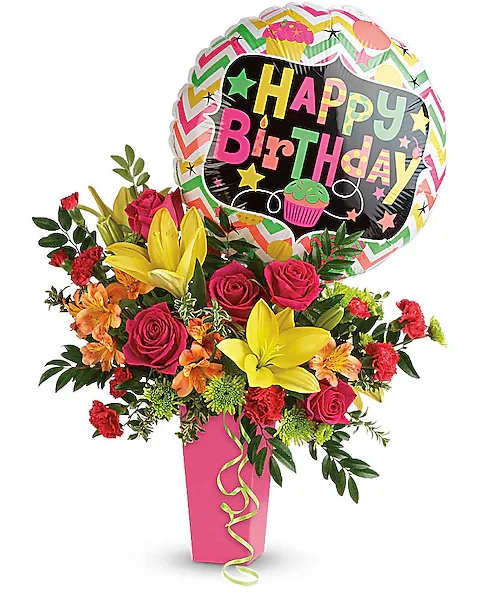 Birthday bouquet with roses, lilies, and a balloon in a pink vase