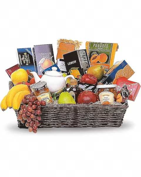 Gift basket with fruit, jam, biscuits, and assorted snacks