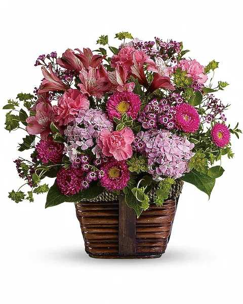 Happily Ever After - Send someone this delightful floral gift of pretty pink blossoms and share the gift of beauty! A glorious selection of fresh flowers is arranged in a rustic basket, then hand-delivered. What could be lovelier? A mix of fresh flowers such as pink carnations, Matsumoto asters, Sweet William and alstroemeria is accented with greenery and delivered in a rustic basket.   Orientation : All-Around  All prices in USD ($)  Due to an increase in the cost of roses, some product prices may be impacted during the Valentine’s delivery period.