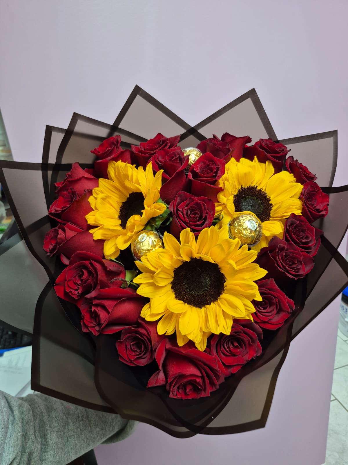 Sunflowers and roses in a heart-shaped bouquet.  - Sunflowers and roses in a heart-shaped bouquet. Perfect for anniversaries and Valentine's Day.