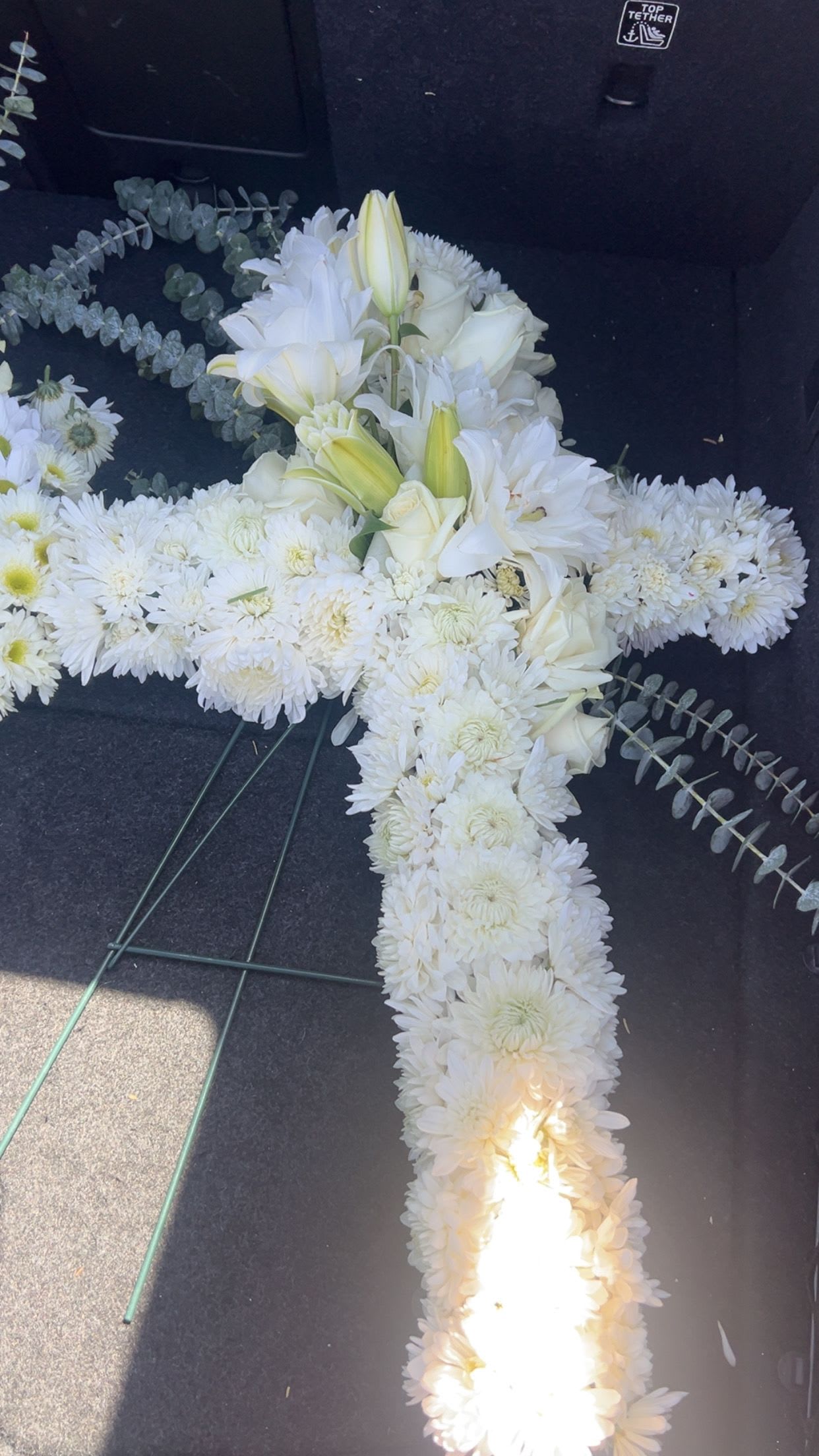 White floral cross arrangement with lilies and chrysanthemums
