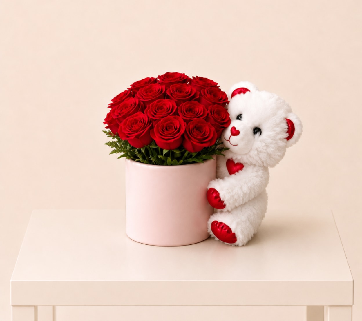 Rose Hat Box with Teddy Bear - A romantic arrangement of fresh red roses designed in a chic blush hat box, paired with a soft white teddy bear. A sweet and elegant gift that combines flowers and plush for the perfect heartfelt surprise.  Perfect  for: Valentine’s Day, anniversaries, romantic surprises, birthdays, I love you gifts, just because.  Available for local flower delivery throughout Naples, Bonita Springs, Estero, Fort Myers and Fort Myers Beach.  Designer’s Choice: Each arrangement is uniquely designed using the freshest seasonal flowers available. Flower varieties, colors and containers may vary while maintaining the overall style, value and beauty of the design.