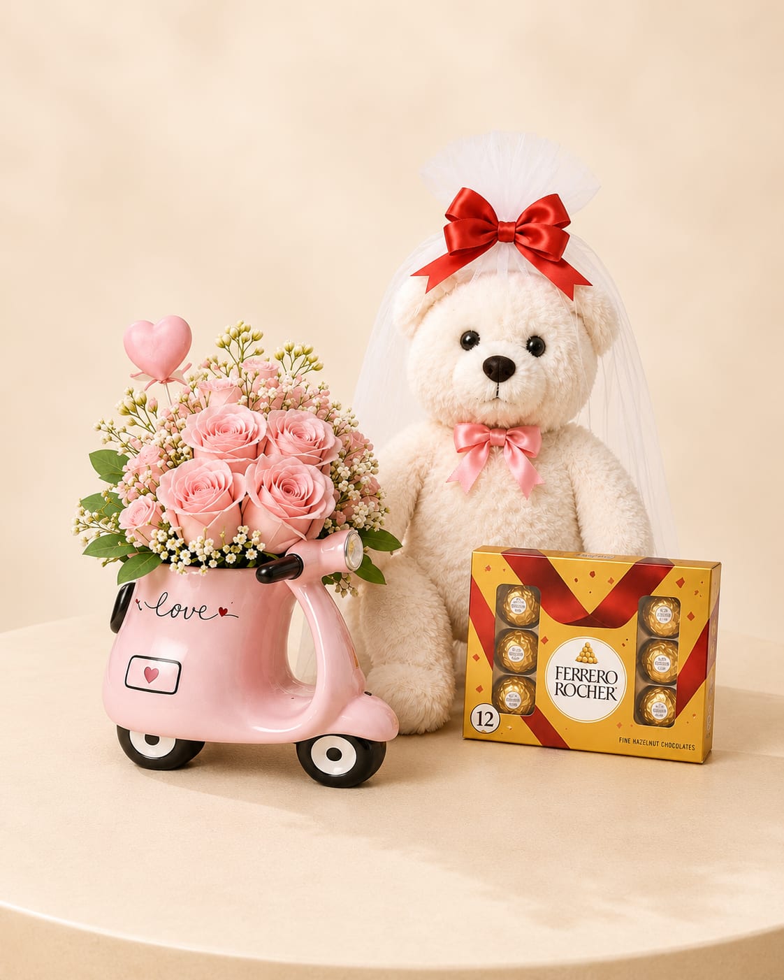 Sweet Blush Romance Gift Set - A soft and romantic floral gift featuring delicate blush roses, beautifully arranged in a charming decorative Vespa keepsake vase. Paired with a cuddly teddy bear presented in a gift bag and a box of Ferrero Rocher chocolates, this thoughtfully curated set delivers sweetness, elegance, and heartfelt charm in one unforgettable presentation.  Perfect for Valentine’s Day, anniversaries, engagements, romantic gestures, or sending a meaningful “I love you” surprise.  Available for local flower delivery throughout Naples, Bonita Springs, Estero, Fort Myers and Fort Myers Beach.  Designer’s Choice: Each arrangement is uniquely designed using the freshest seasonal flowers available. Flower varieties, colors and containers may vary while maintaining the overall style, value and beauty of the design.