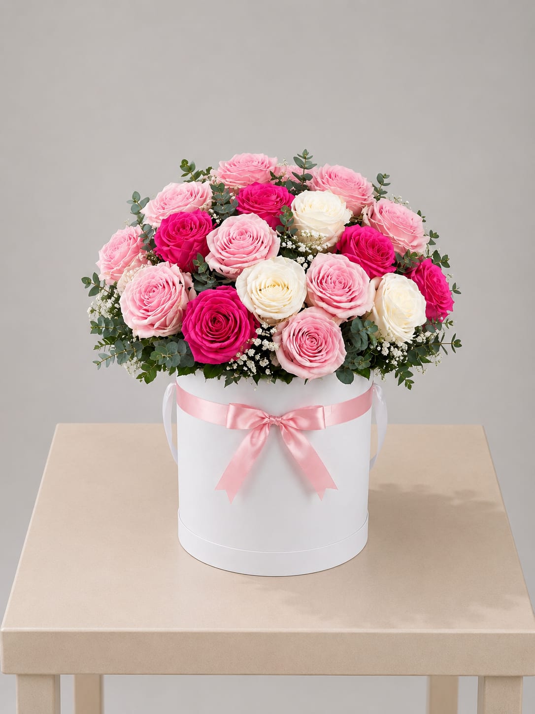 Blush &amp; Pink Rose Hat Box – Tall  - A refined and elegant floral design featuring a curated mix of hot pink, blush pink, and classic white roses, beautifully arranged in a modern white hat box and finished with a soft satin ribbon.  Designed with a fuller and more elevated profile, this arrangement showcases the natural beauty of each rose with soft texture and a more abundant, elegant presence. Accented with delicate baby’s breath and fresh greenery, it creates a romantic look that feels both elevated and timeless.  Perfect for: Mother’s Day, birthdays, anniversaries, thank you, get well, or when you want to make a more generous and memorable impression.  Available for local flower delivery throughout Naples, Bonita Springs, Estero, Fort Myers and Fort Myers Beach.  Designer’s Choice: Each arrangement is uniquely designed using the freshest seasonal flowers available. Flower varieties, colors and containers may vary while maintaining the overall style, value and beauty of the design.