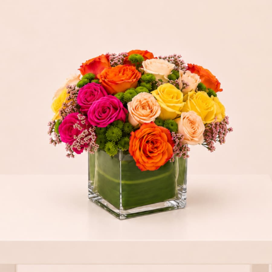 Vibrant Garden Blooms - A full-color explosion, Kaleidoscope is a beautiful gift for anybody you want to impress. Mother-in-law, your boss, a client, etc... this arrangement is a crowd pleaser and an eye-catcher.  Perfect  for: Valentine’s Day, Anniversary, Love &amp; Romance, Birthday, Thinking of You, Just Because, Mother’s Day, Women’s Day.  Available for local flower delivery throughout Naples, Bonita Springs, Estero, Fort Myers and Fort Myers Beach.  Designer’s Choice: Each arrangement is uniquely designed using the freshest seasonal flowers available. Flower varieties, colors and containers may vary while maintaining the overall style, value and beauty of the design. 