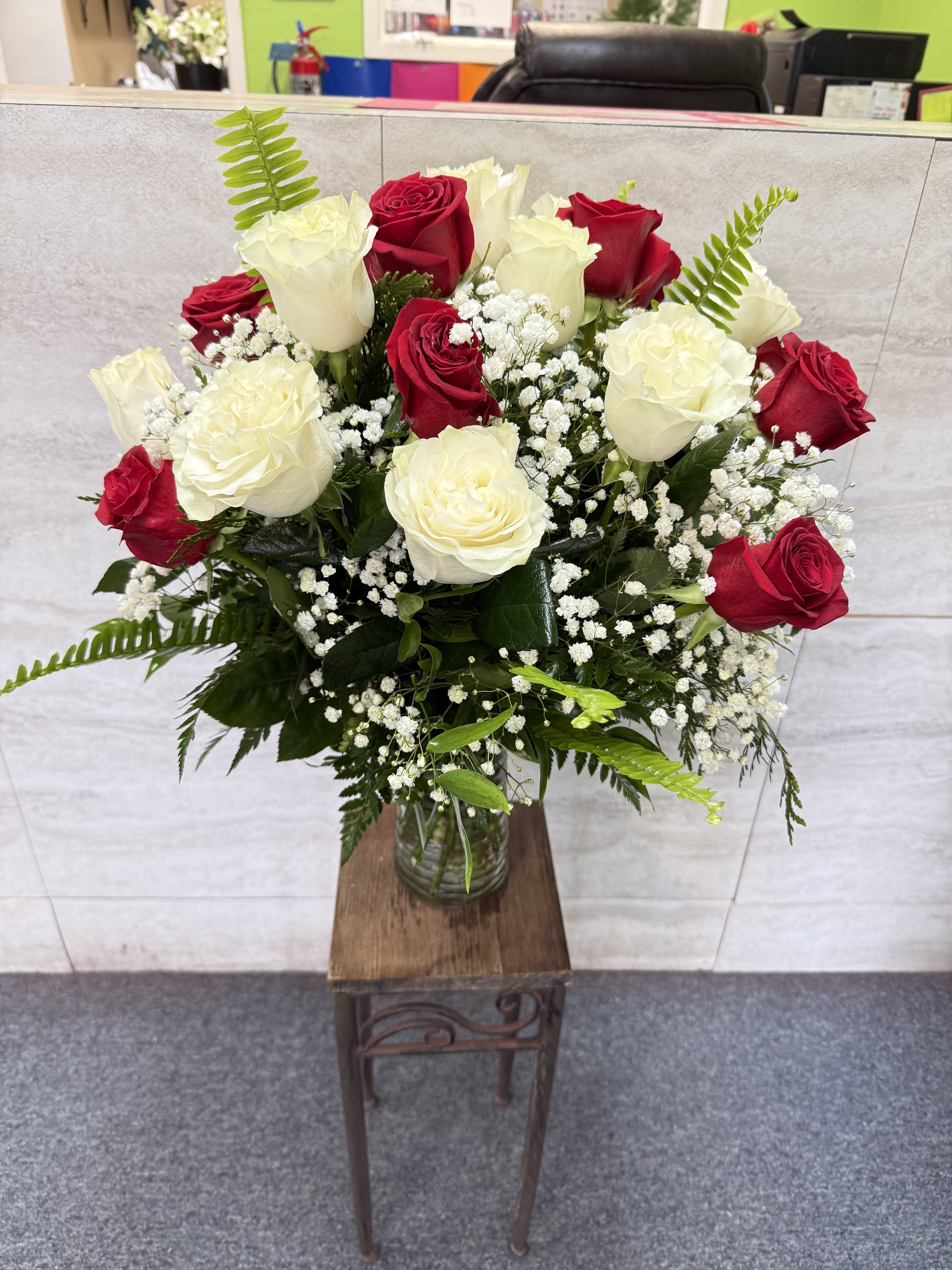 Your's Truly - (ALL-ROUND) Red and white roses with lush greens and baby's breath in a clear vase-classic, romantic arrangement perfect for anniversaries, Mother's Day, Valentine's Day, or heartfelt gestures.