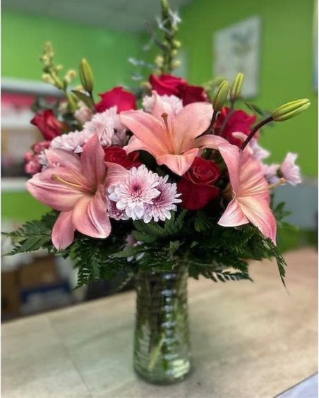 Cupid's whisper  - (ONE-SIDED) For your Valentine's. An arrangement of red roses and pink Asiatic lilies.