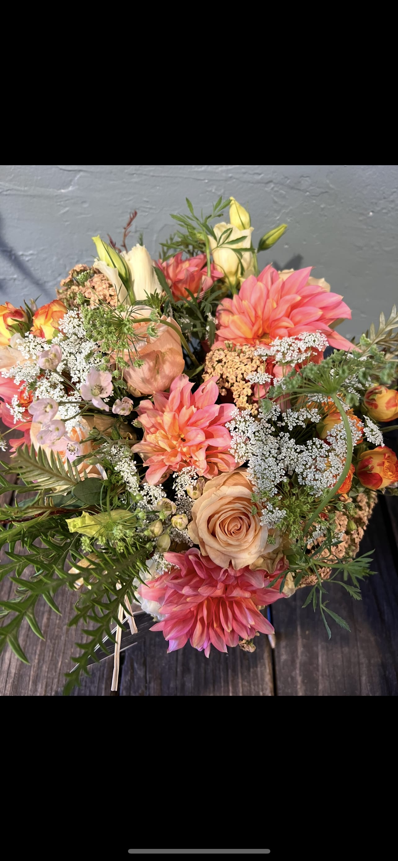 Whispering peach  - A romantic garden composition in sun-washed peach and coral tones, designed with airy, natural movement. Whispering Peach feels like a love note in floral form — gentle, joyful, and touched with luxury.