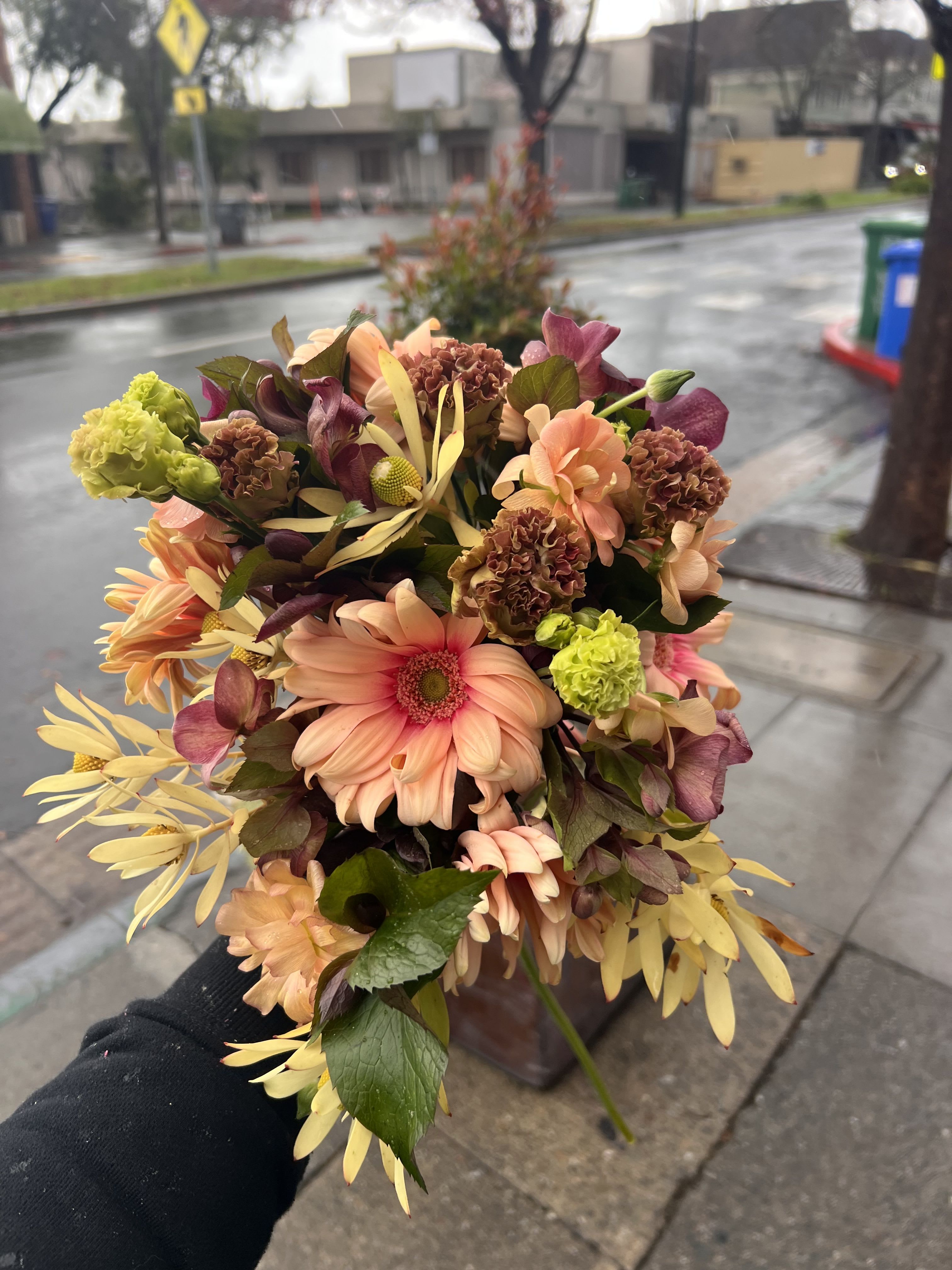 Rain-Kissed Caramel - Warm peach, caramel, and blush blooms arranged with intentional movement and emotional storytelling — like a rainy morning wrapped in flowers. Designed to feel intimate and unforgettable, perfect for gifting someone you love (yourself included).
