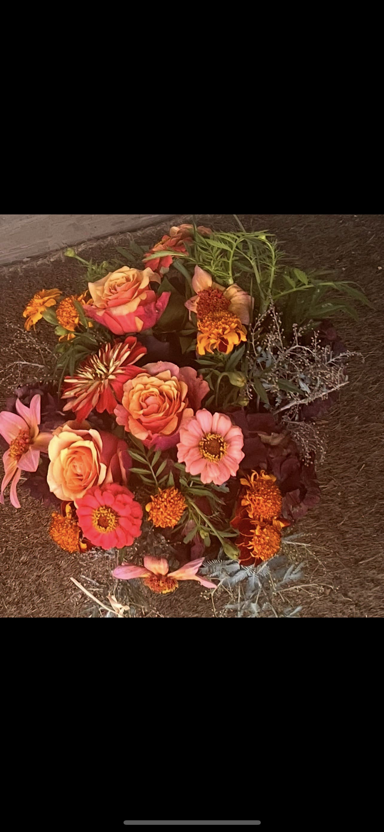 Sunset Devotion - A glowing celebration of coral roses, marigolds, and garden blooms gathered in rich sunset tones. Designed with a romantic, wild-meets-refined touch, Sunset Devotion feels like golden hour captured in flowers — warm, passionate, and unforgettable.