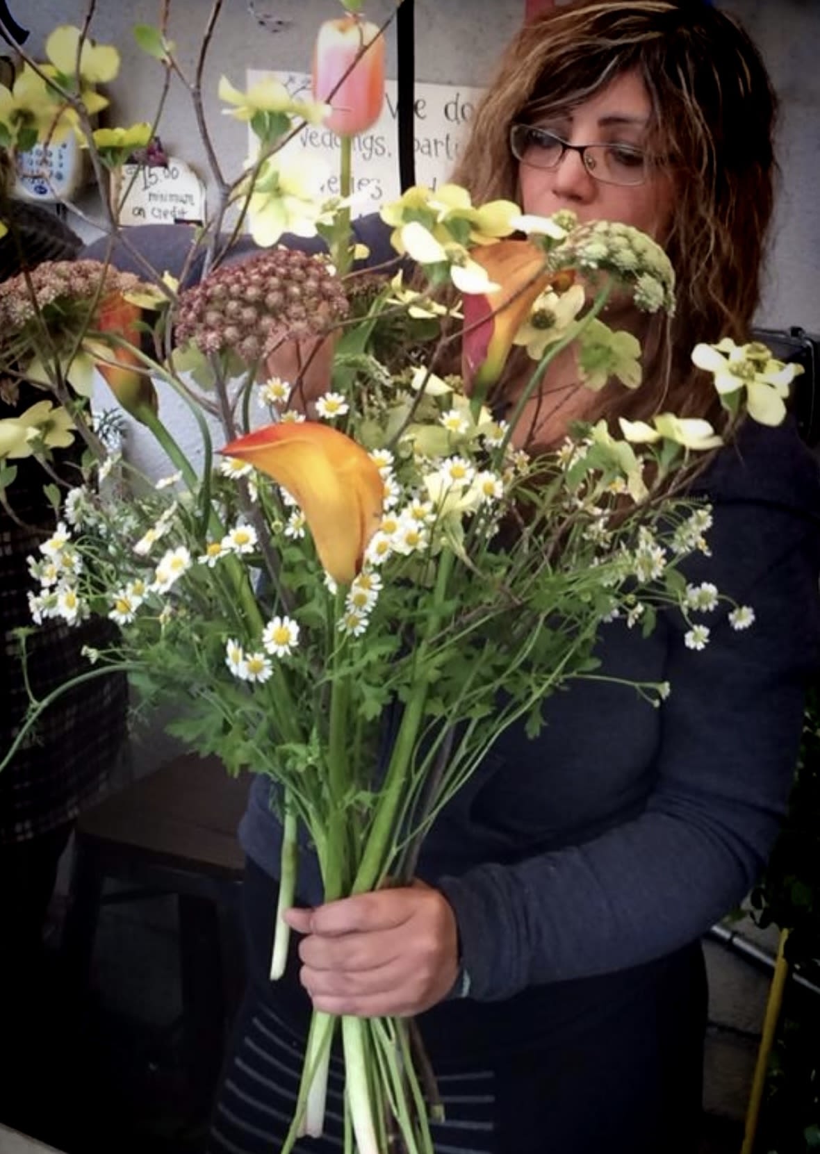 Sun-Kissed meadow  - A hand-gathered bouquet that feels like stepping into a sun-kissed meadow. Golden calla lilies, chamomile, and wild textures come together in a soft, poetic embrace—perfect for anyone who believes flowers should feel like a memory. 