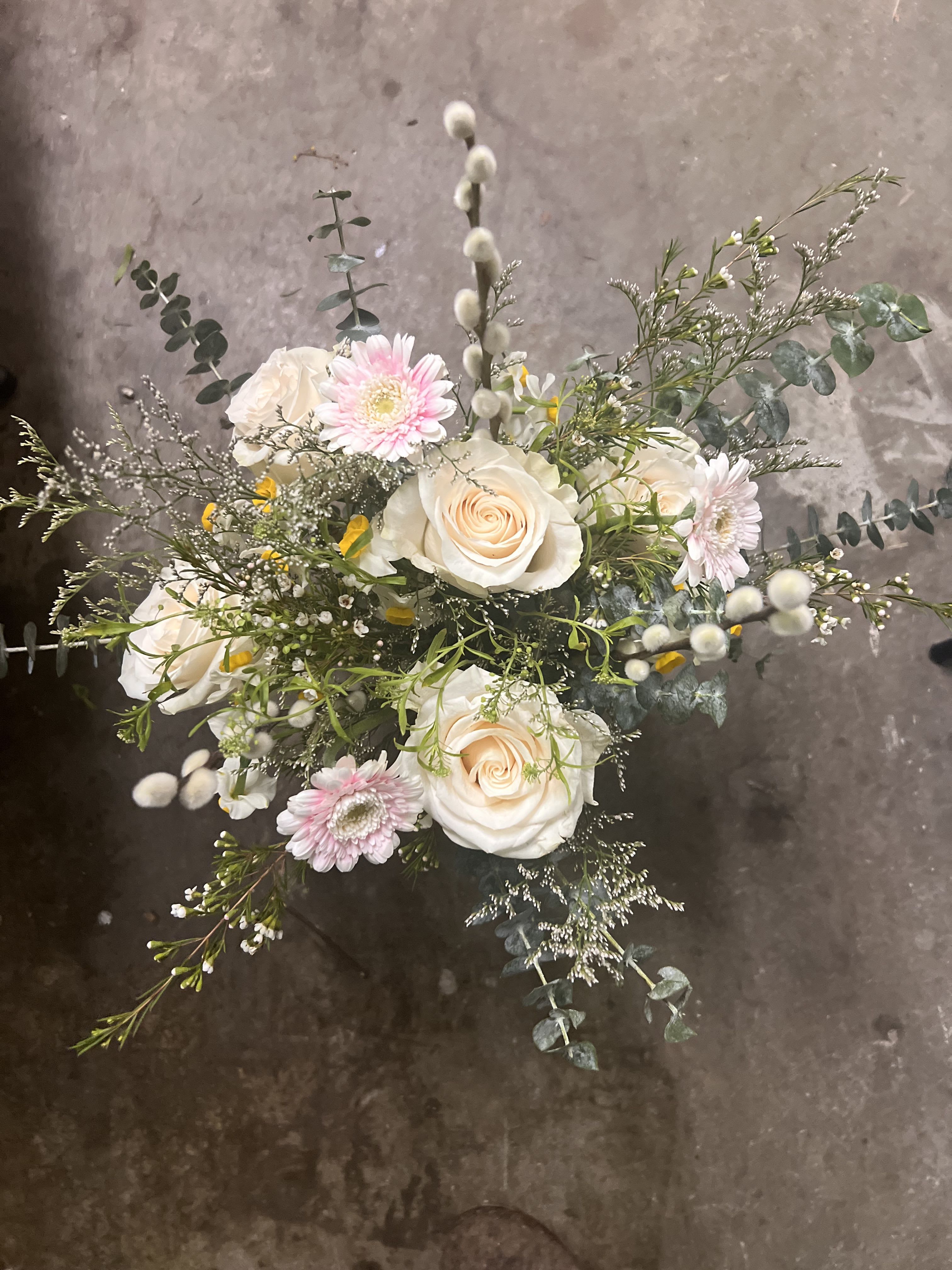 Ivory Meadow Garden - Ivory Meadow Garden is a delicate, garden-inspired floral arrangement featuring creamy white roses, soft blush blooms, seasonal accent flowers, and airy greenery. Designed with natural movement and organic texture, this handcrafted arrangement feels light, romantic, and timeless. Perfect for birthdays, anniversaries, sympathy, celebrations, or elegant everyday gifting, each design is created using the freshest seasonal flowers available.