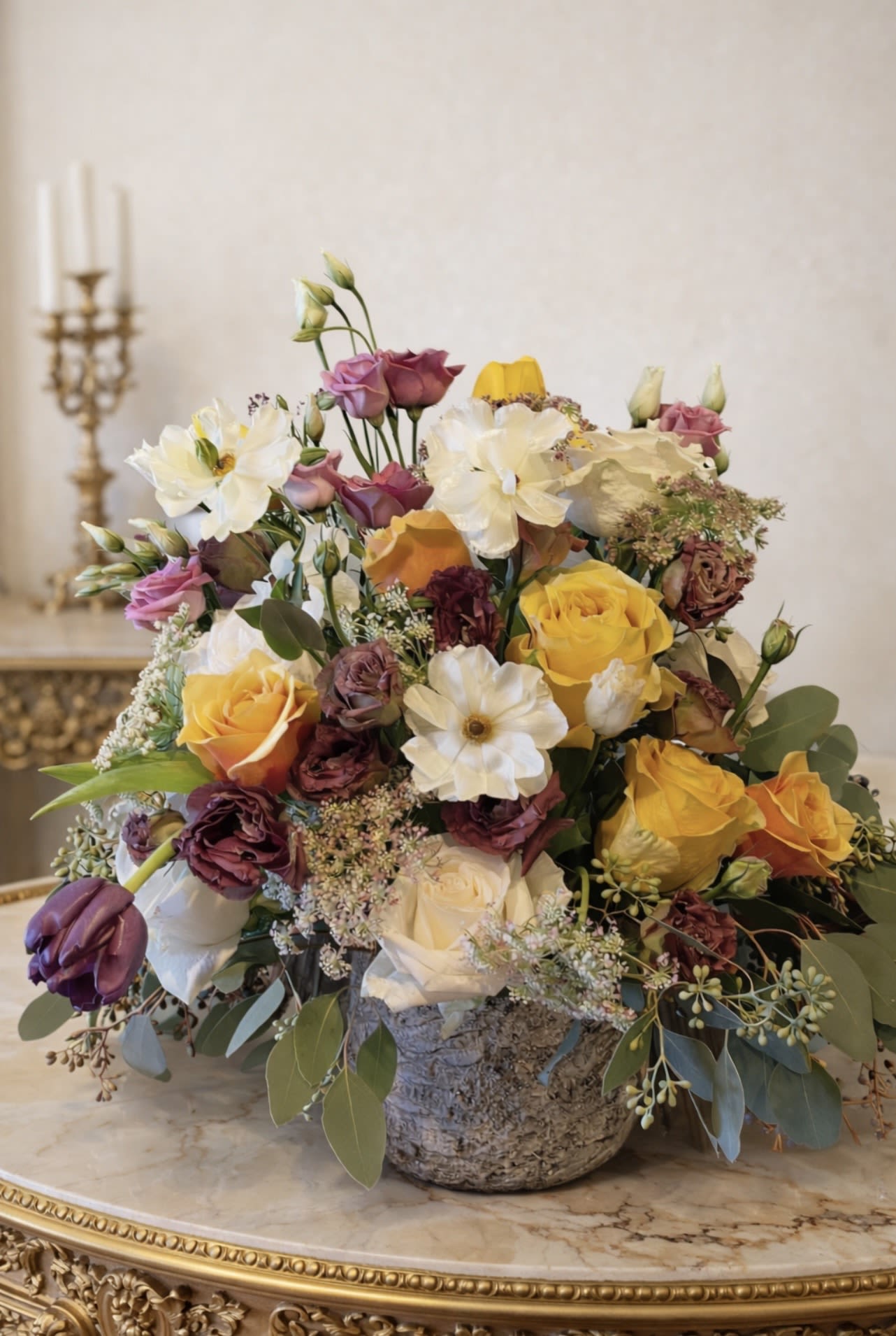 Harvest  - Inspired by the sweetness of memory and the softness of morning light. Harvest marries warm amber tones with delicate cream petals and hints of plum for depth. A luxurious, sensory design that feels like stepping into a dream — tender, opulent, and deeply romantic. 