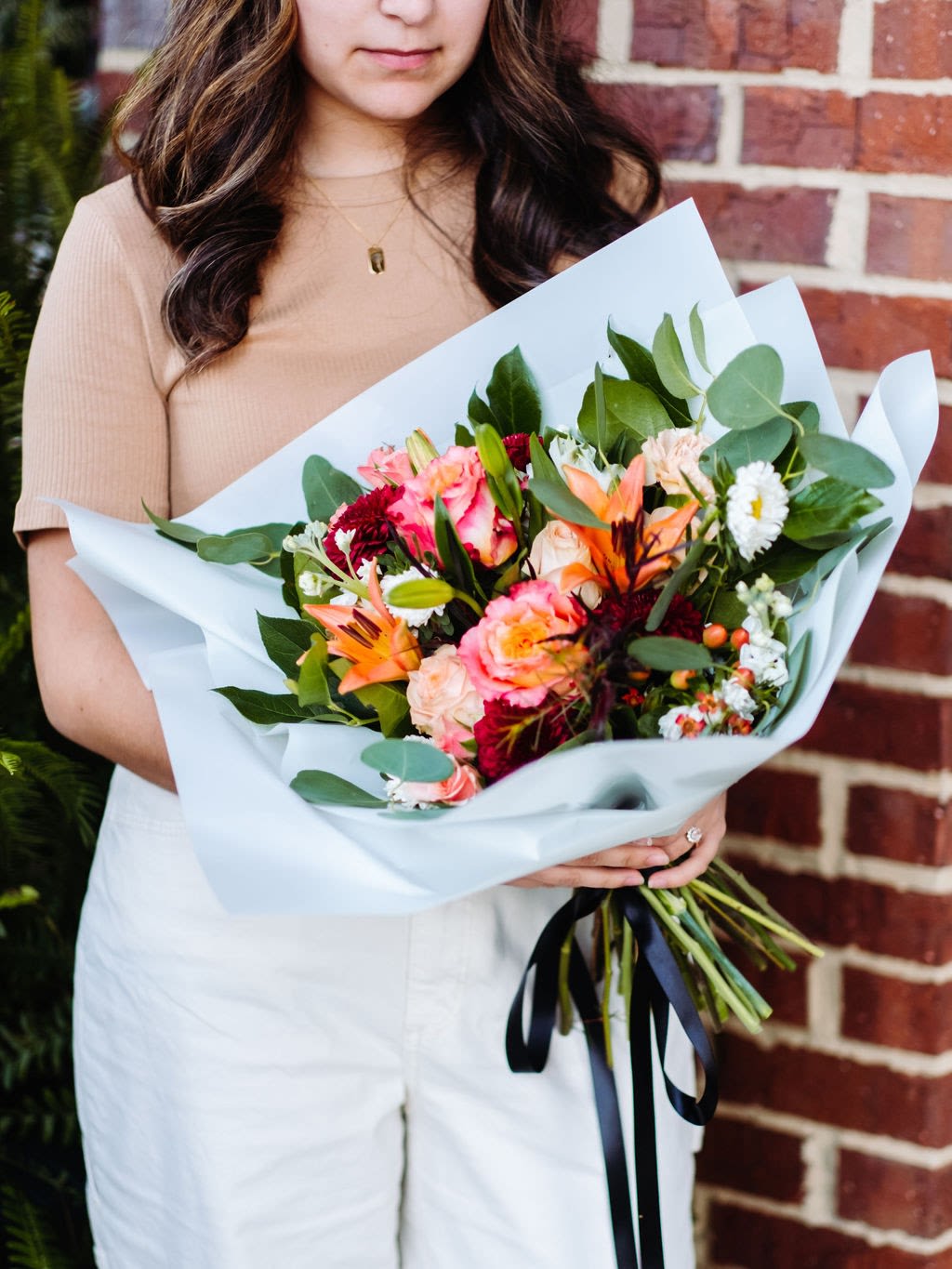 Classic Wrapped Bouquet - Dark &amp; Moody - Our Fleurs + Events Designer’s Choice Collection is a hand-selected assortment by our designers with the freshest seasonal blooms available to create a gorgeous wrapped bouquet for you or your loved one. Designer Choice Petite has 13-15 stems. Deisgner Choice Classic has 15-20 Stems. Designer’s Choice Signature has 20-25 stems and Designer Choice Grande has 25-30 stems. Order today!  Please note that the flower varieties pictured may vary due to seasonal availability. However, rest assured that you will receive premium, fresh blooms of equal or greater value, ensuring a beautiful and high-quality arrangement every time.  If any elements of design are of major importance to your order, please include them in the Order Notes section at checkout, or please call or email us directly.