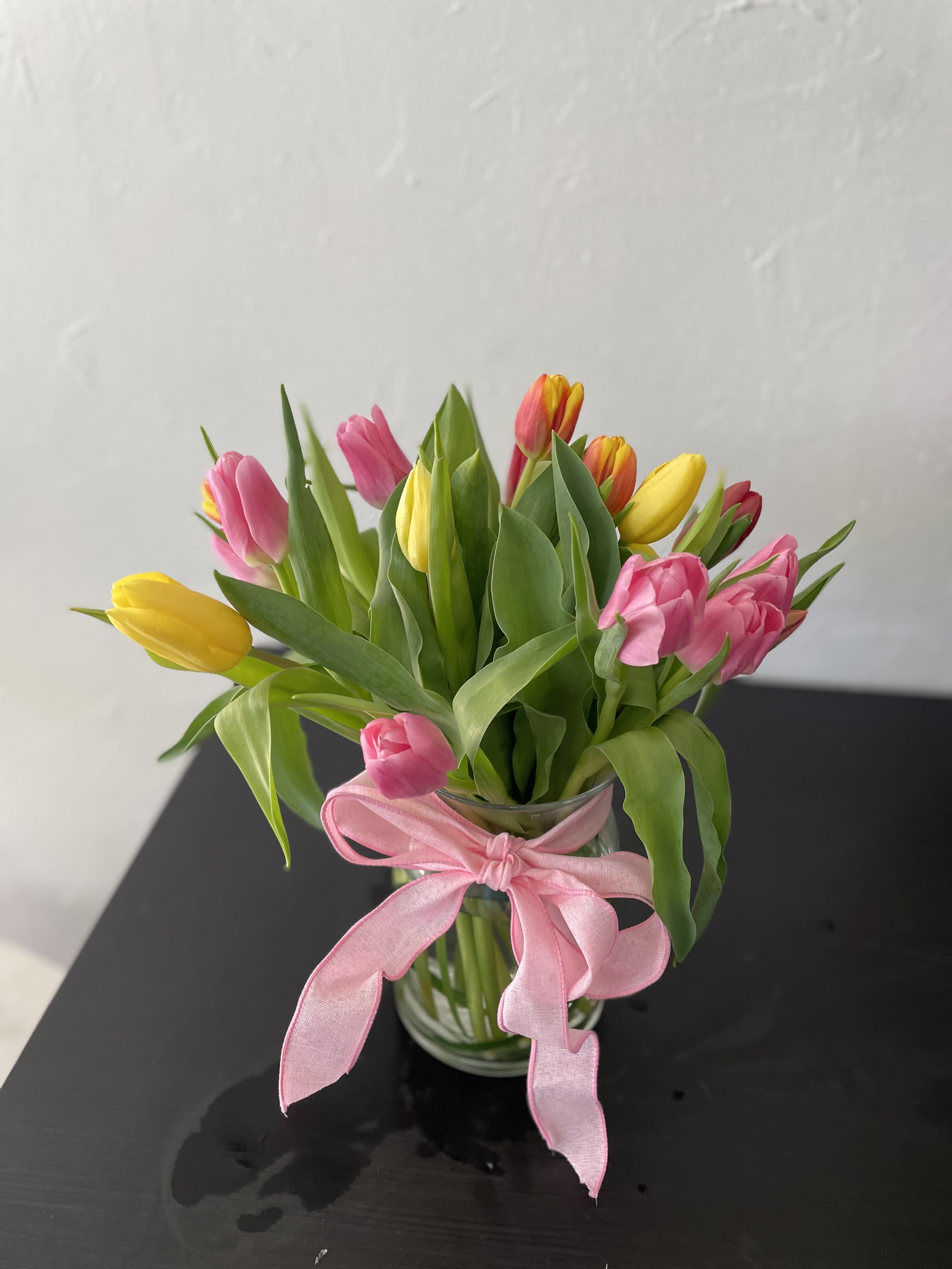Tulip Mania by BloomNation™ - Send a selection of tulips to somebody you have unconditional love for! Always treasured and appreciated, Tulips have a rich history and are loved by all making them a fan favorite for Mother's Day. They also are a great option for celebrating an anniversary or just because.  1st Image: Standard 2nd Image: Premium