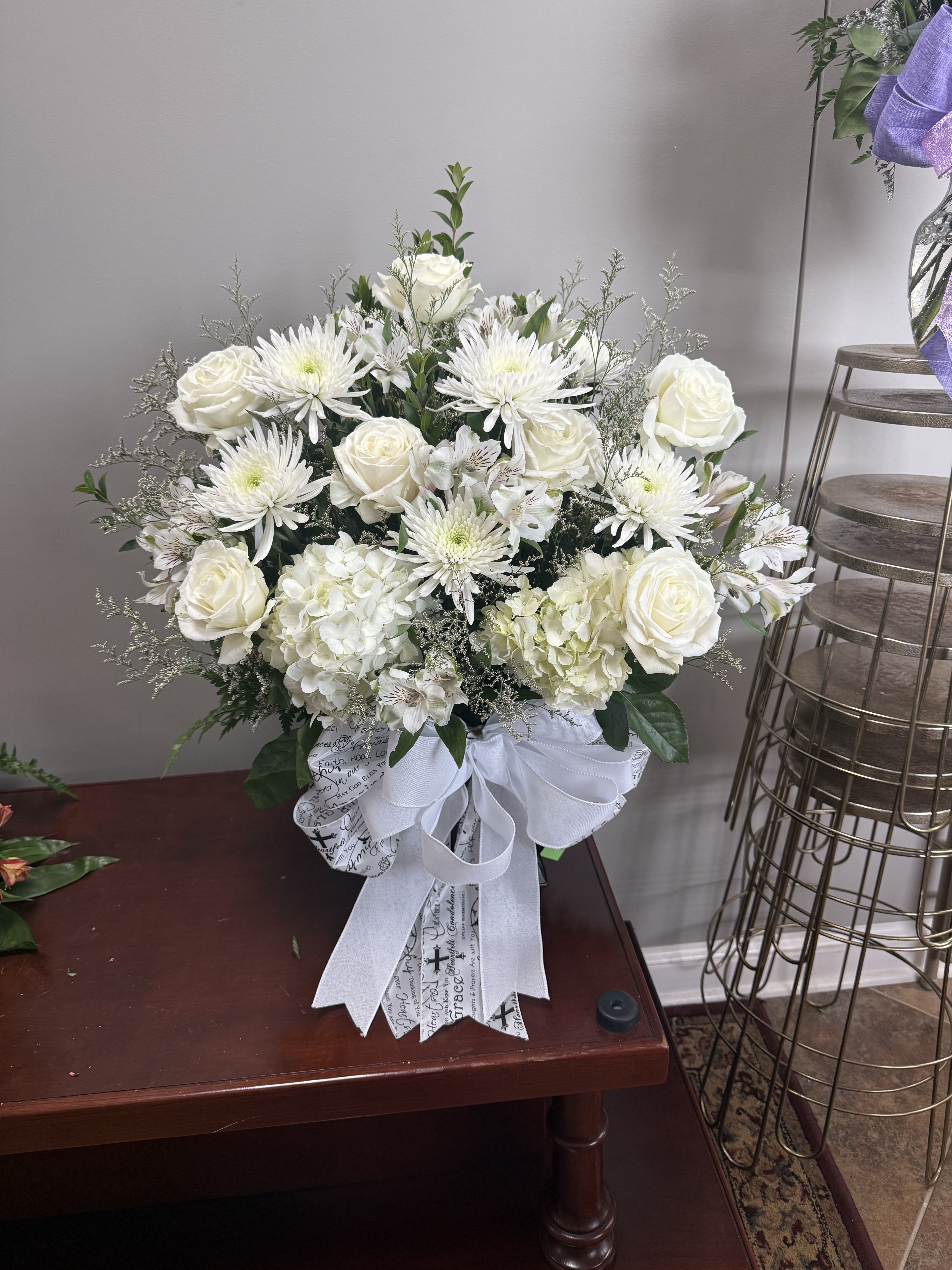 Heaven sent - White roses, hydrangeas, small mums and greenery. 
