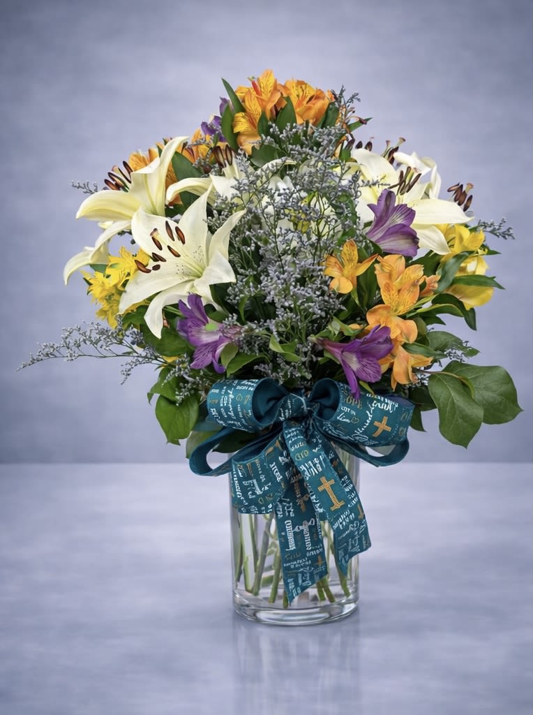 Beautiful sunshine  - Lilies and Alstros arranged in a vase with a beautiful bow. Colors may may vary. 