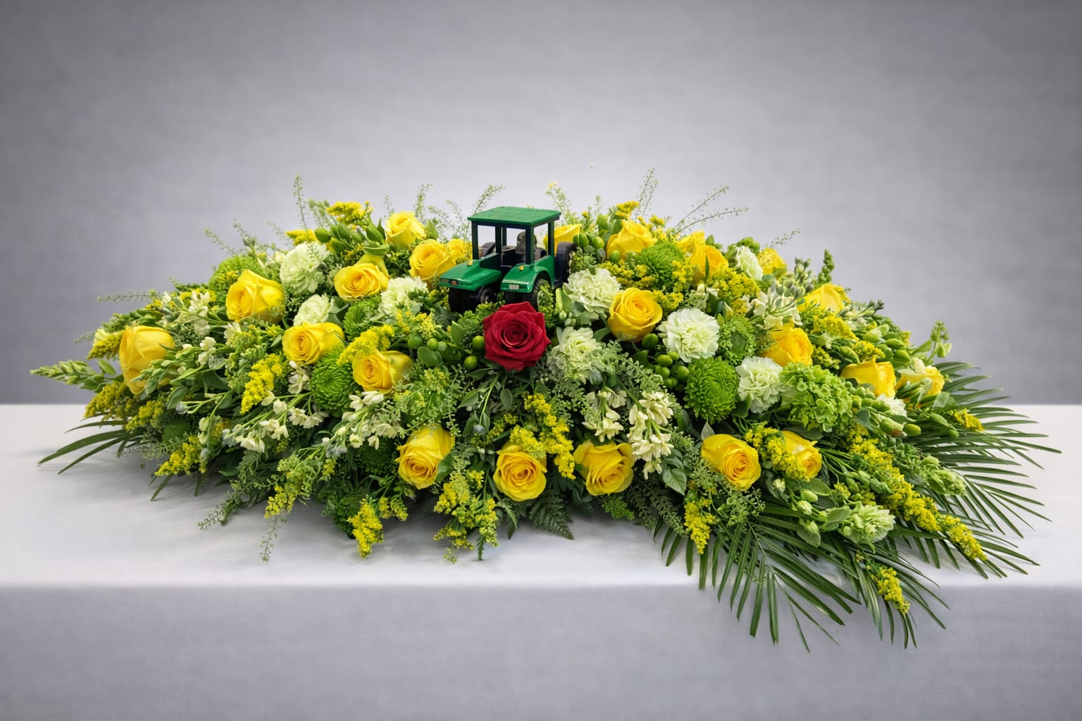 Boundless Love - Yellow and white roses with greenery and John Deere tractor.  Tractor can be changed out for something else. 