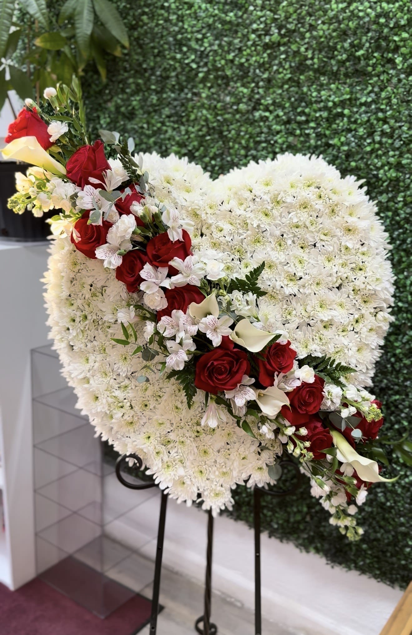 forever yours sympathy heart  - 26' full heart wreath filled with white cushion pom mums with 24 red freedome roses 4 small calla lilies white mini carnations lether leaf greenery available in 18' 