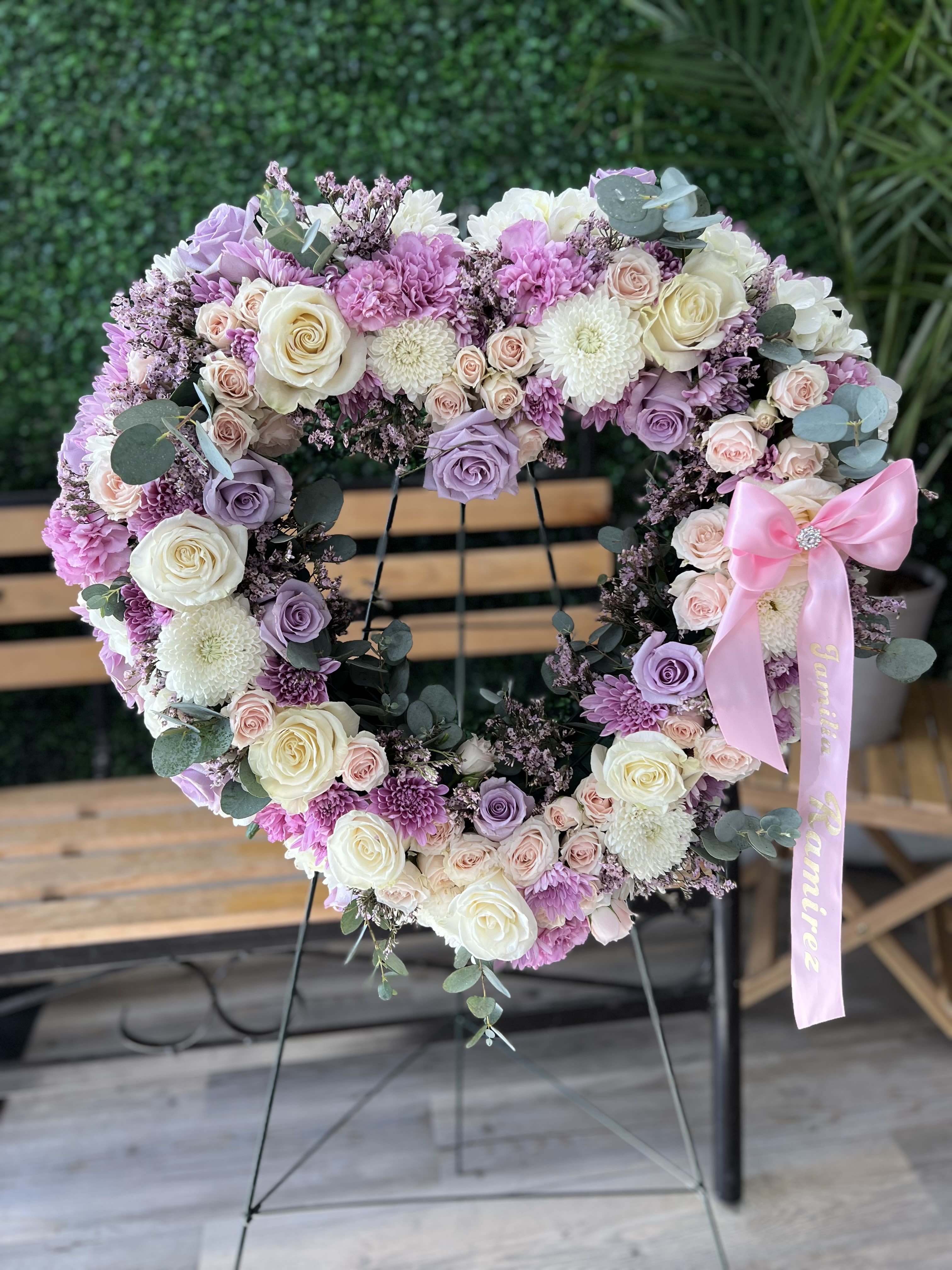 Elegant remembrance heart - A heartfelt sympathy arrangement designed in a classic heart shape featuring soft pastel blooms and delicate greenery to honor a life with love peace and remembrance