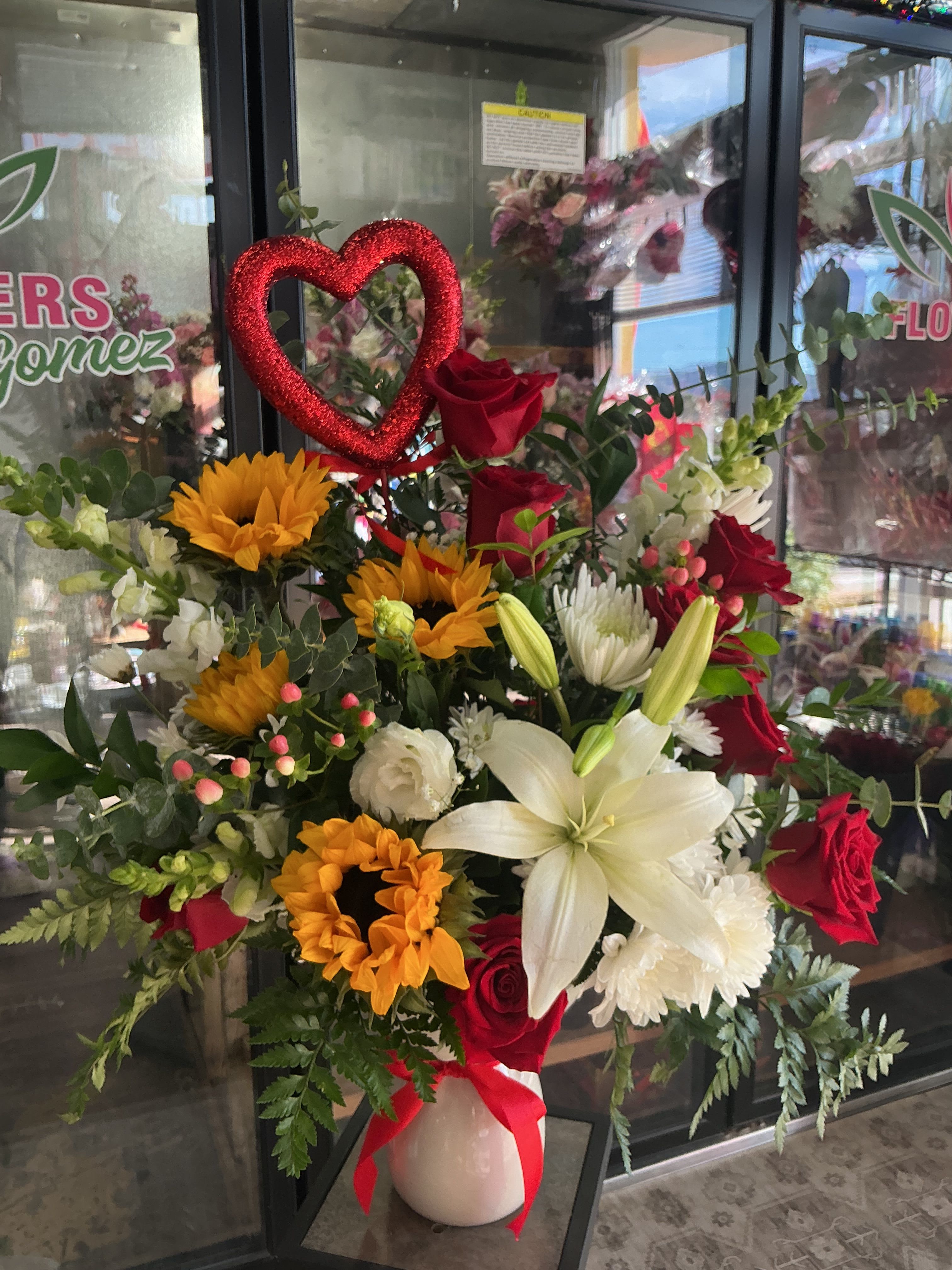 My Valentine’s day  - This amazing arrangement is a perfect way to star your Valentine’s day , made of roses ,sunflowers ,lillies,and all of the greens that giving a plus 