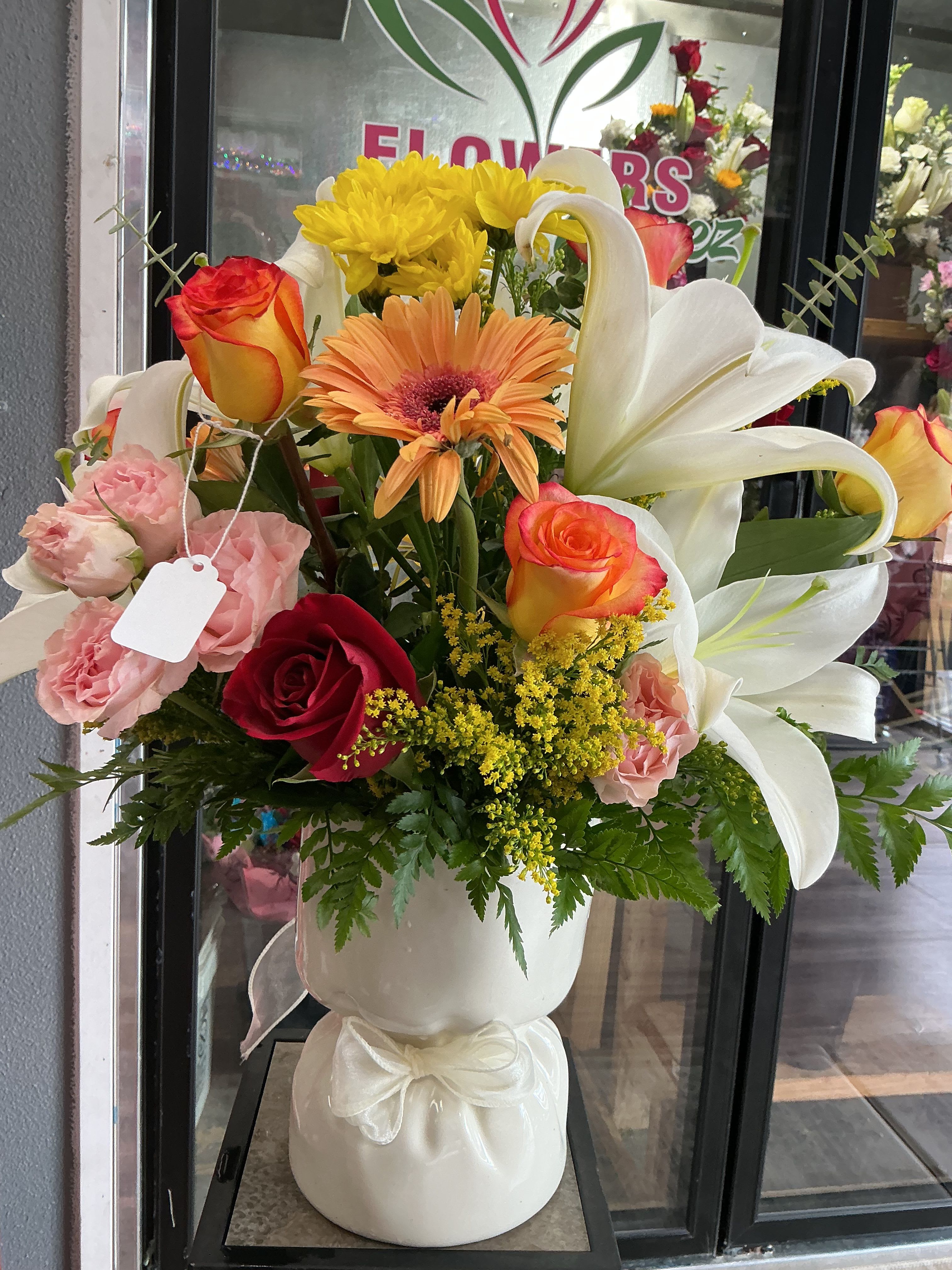 Sunrise - This beautiful arrengment is like a sunrise perfect to start your day , made of a mix of flowers , red roses , orange roses, white lilies , pink carnations ,