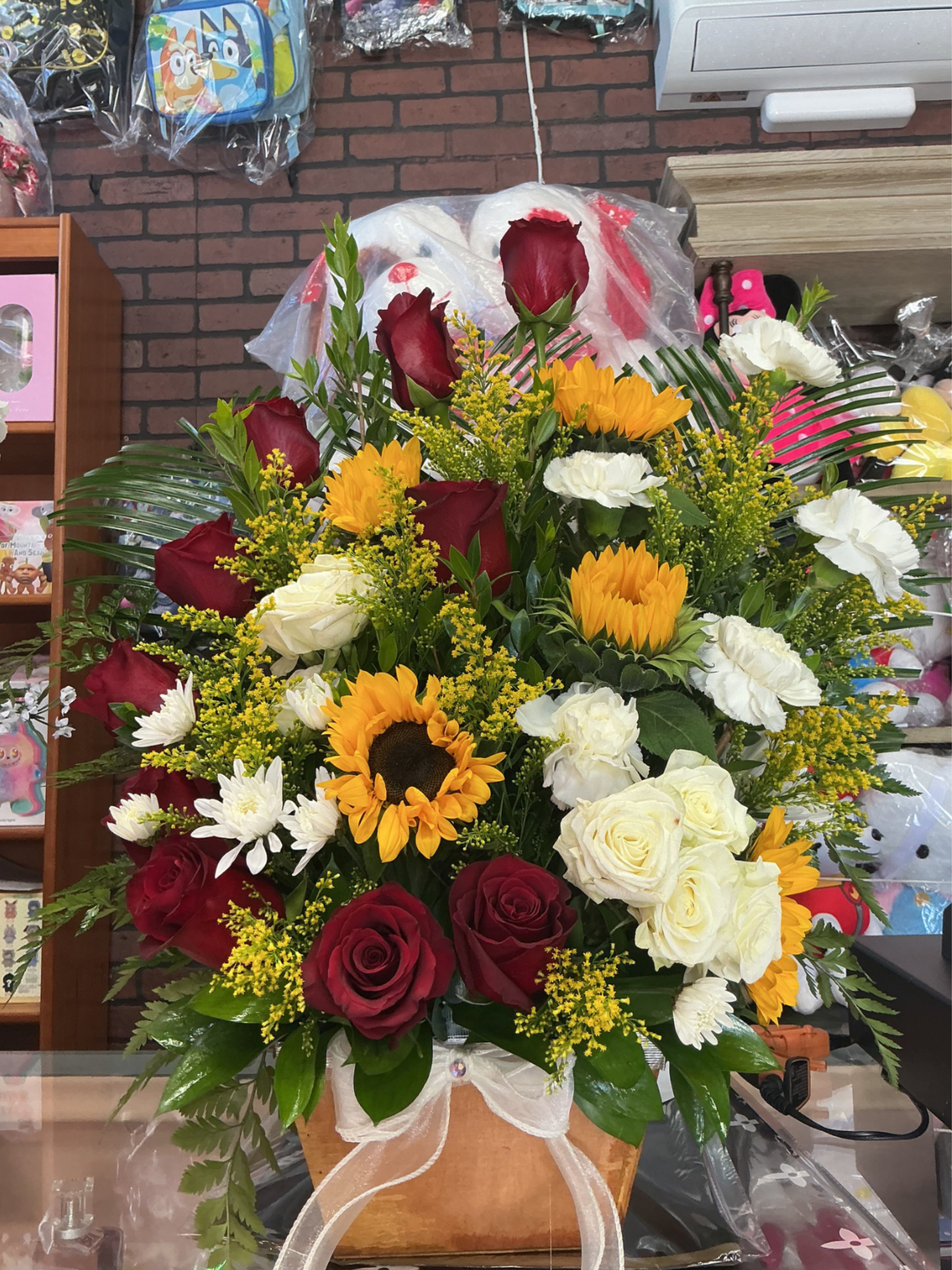 Love love  - This big arrengment is made of red roses and some beautiful sunflowers white carnation and white roses 