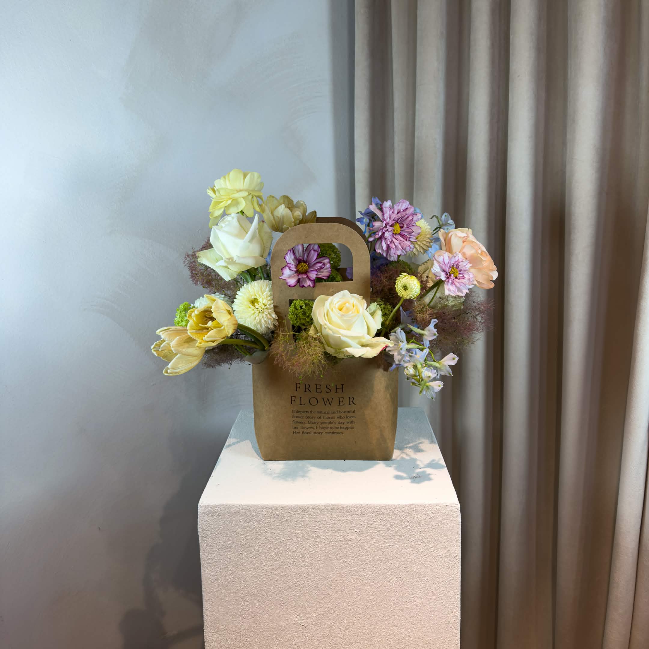 Brown Baek Box - Our Brown Baek Box is a modern alternative to traditional floral arrangements. Designed with a hand-selected mix of fresh seasonal blooms, unexpected textures, and interesting shapes, each box brings together flowers and thoughtful composition in a distinctive presentation. Choose your preferred color palette or leave the creative direction entirely to us with Petal Designer's Choice. Every arrangement is created from scratch. No fixed recipes, no repeated designs.  WHAT'S INCLUDED Original floral design in our signature brown floral box Handwritten message card Flower care instructions  ORDERING &amp; DELIVERY We recommend ordering 2–3 days in advance for the best flower selection. For same-day availability, call or text 704.975.2774.  PLEASE NOTE Product images are for inspiration only. Flower varieties, colors, textures, and overall composition will vary based on seasonal availability and our designer's creative direction. We do not repeat previous designs or recreate another florist's work.  FINAL SALE POLICY All orders are final sale. Due to the custom and perishable nature of our floral designs, cancellations, refunds, and exchanges are not accepted once an order is placed.