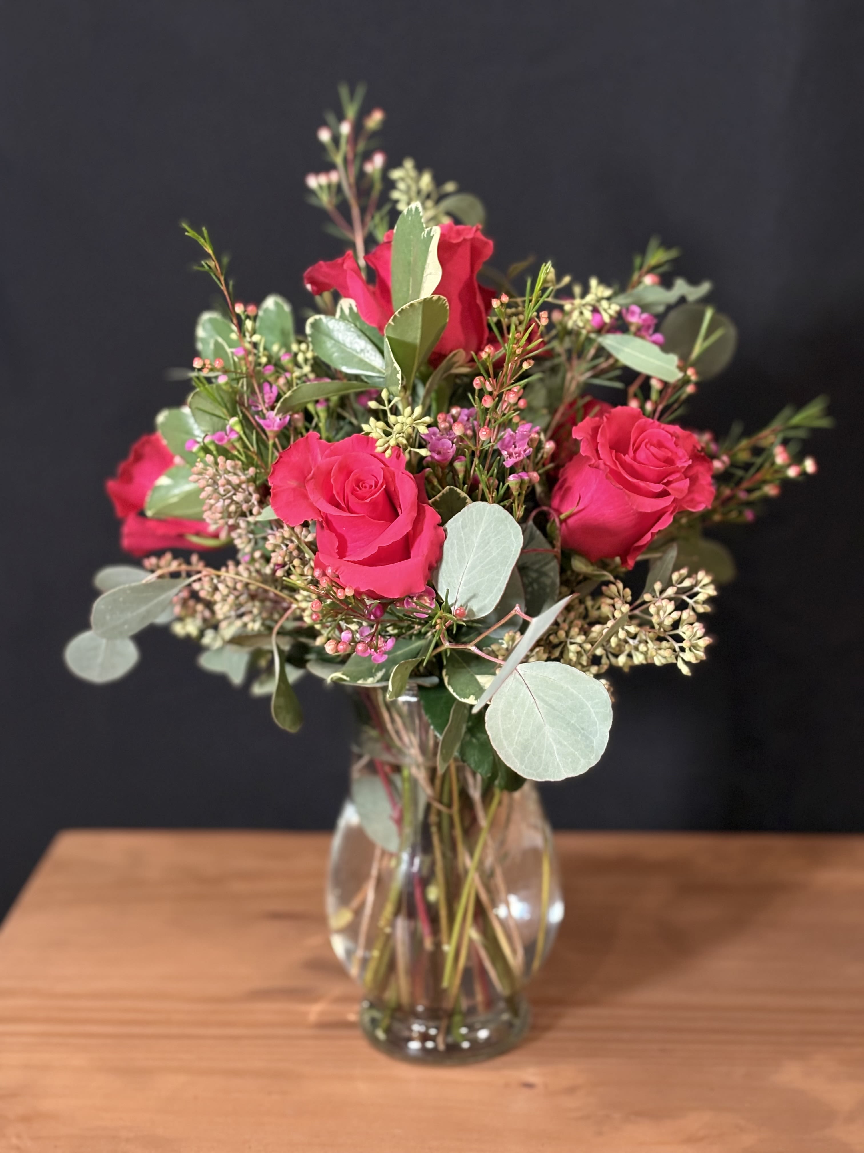 Half A Dozen Roses - A charming half dozen roses offers a graceful expression of love and appreciation. Each bloom is carefully selected, showcasing soft, lush petals and natural beauty. Perfectly balanced and elegantly arranged, six roses convey a heartfelt message that feels both intimate and thoughtful. An understated yet meaningful gesture for any occasion.
