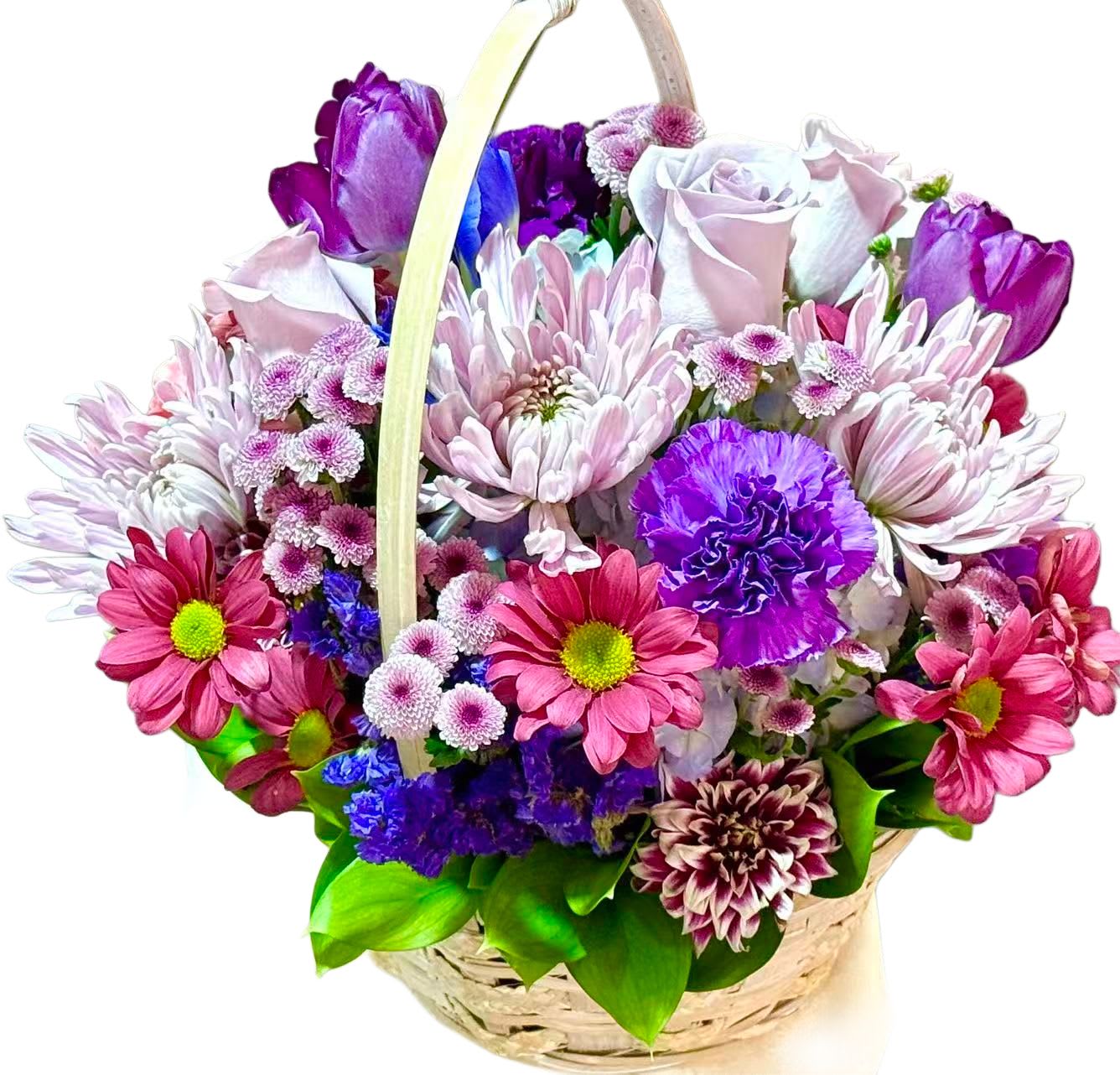 Basket of pink, purple, and white flowers with a handle