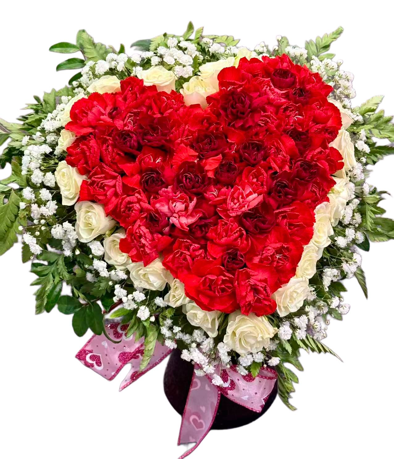 Heart-shaped bouquet of red and white roses with baby's breath