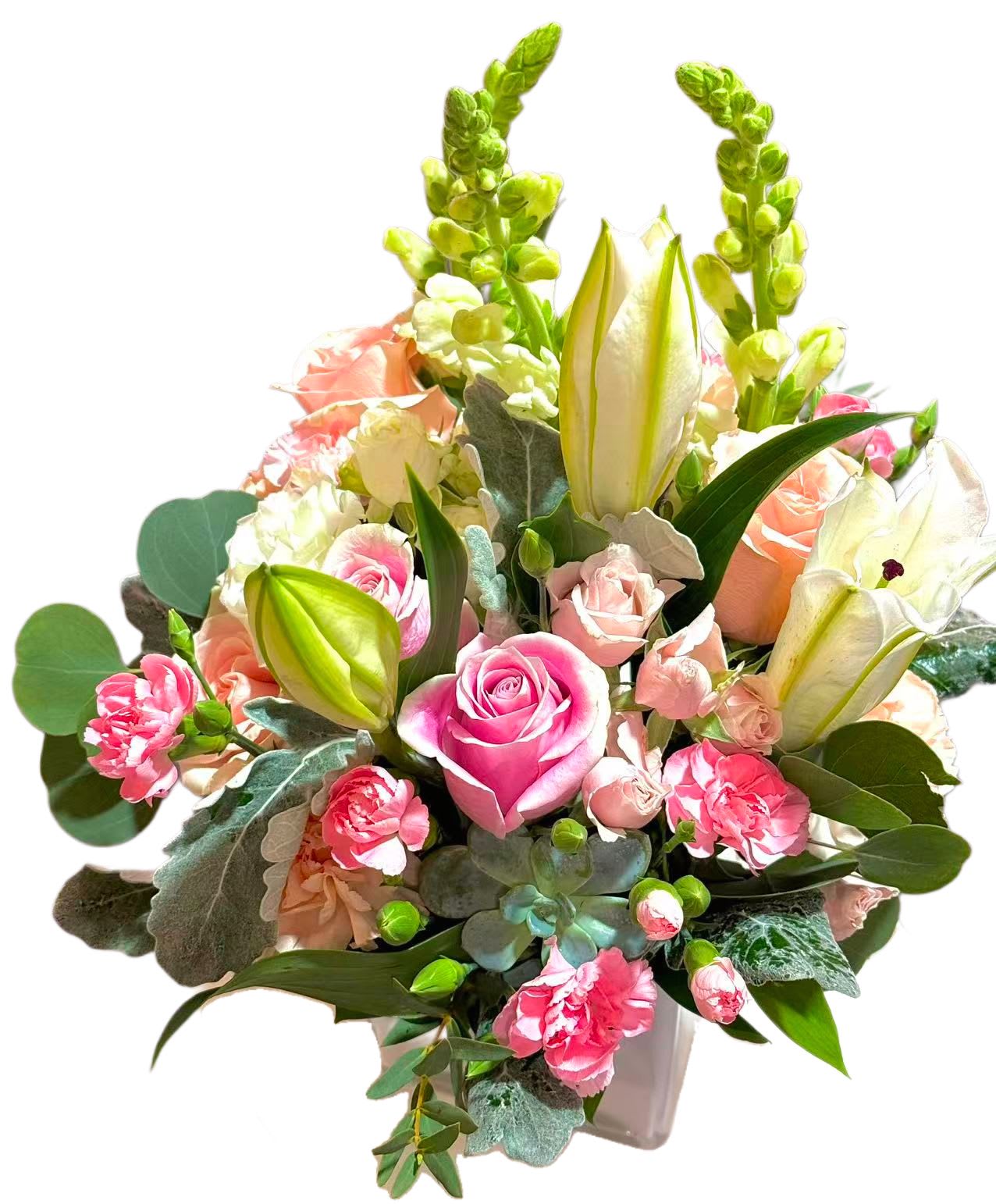 Pink and peach bouquet with roses, lilies, and carnations in a vase