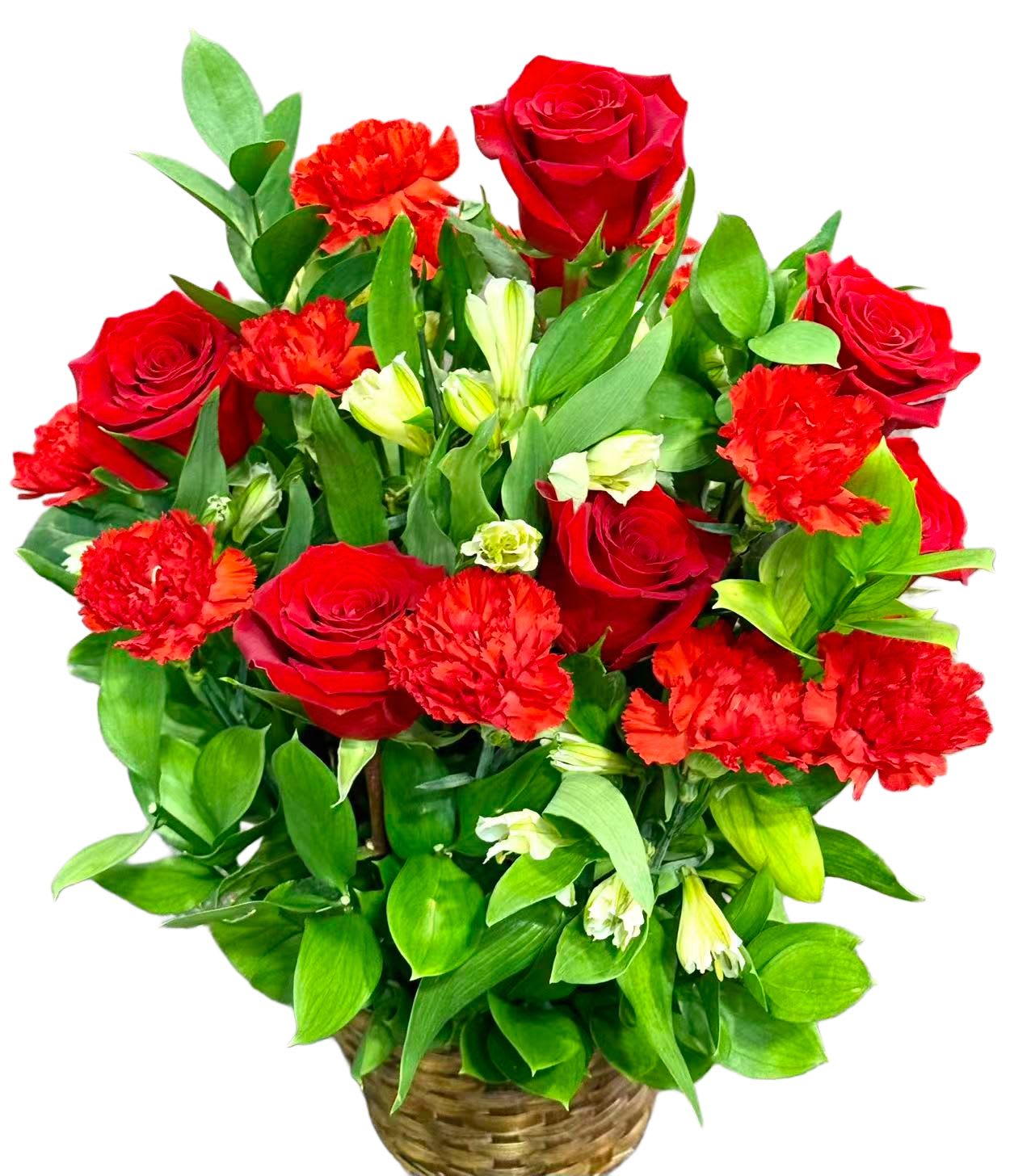 Red roses and carnations in a woven basket