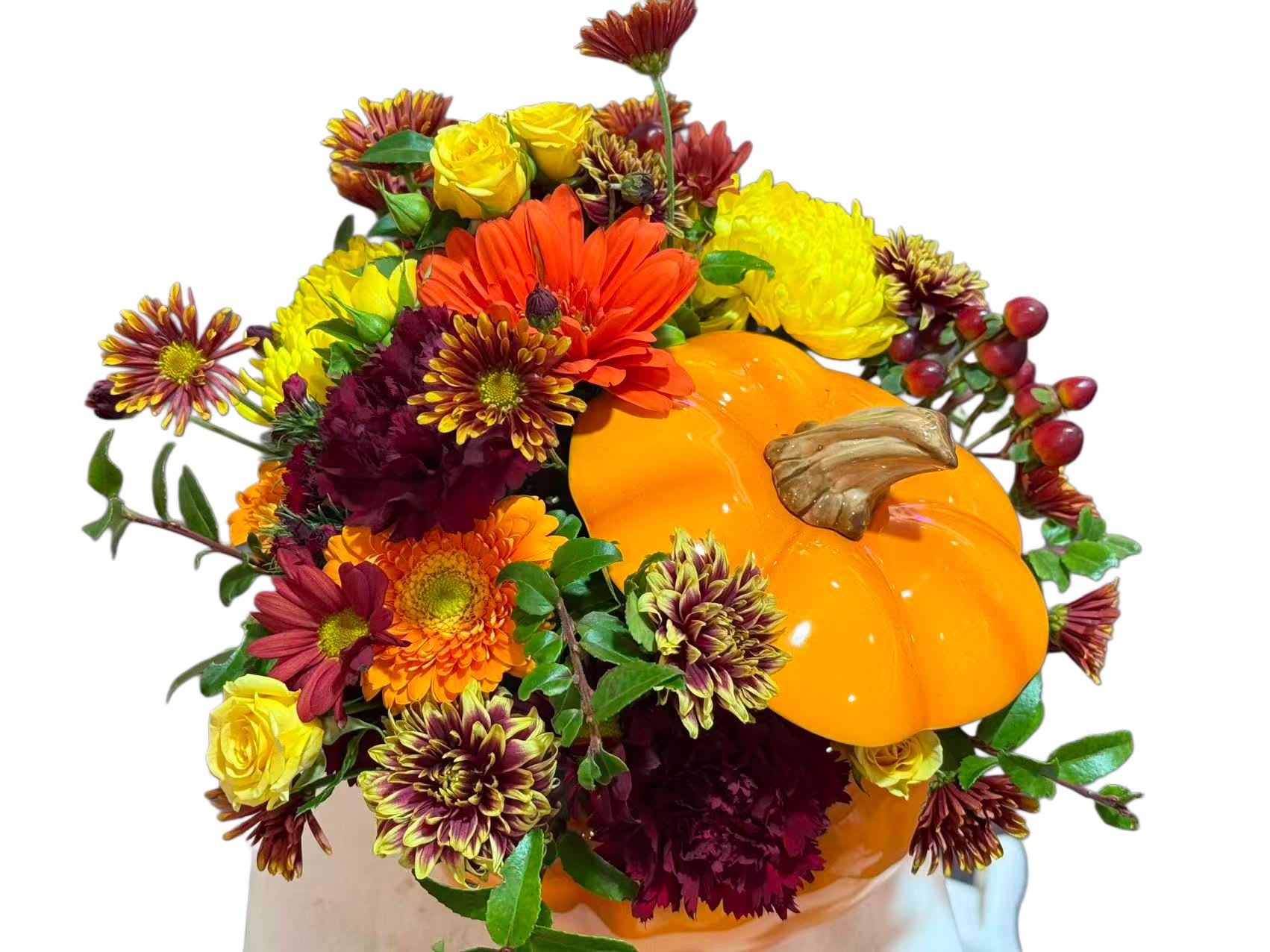 Fall bouquet with a pumpkin and mixed orange, yellow, and burgundy flowers