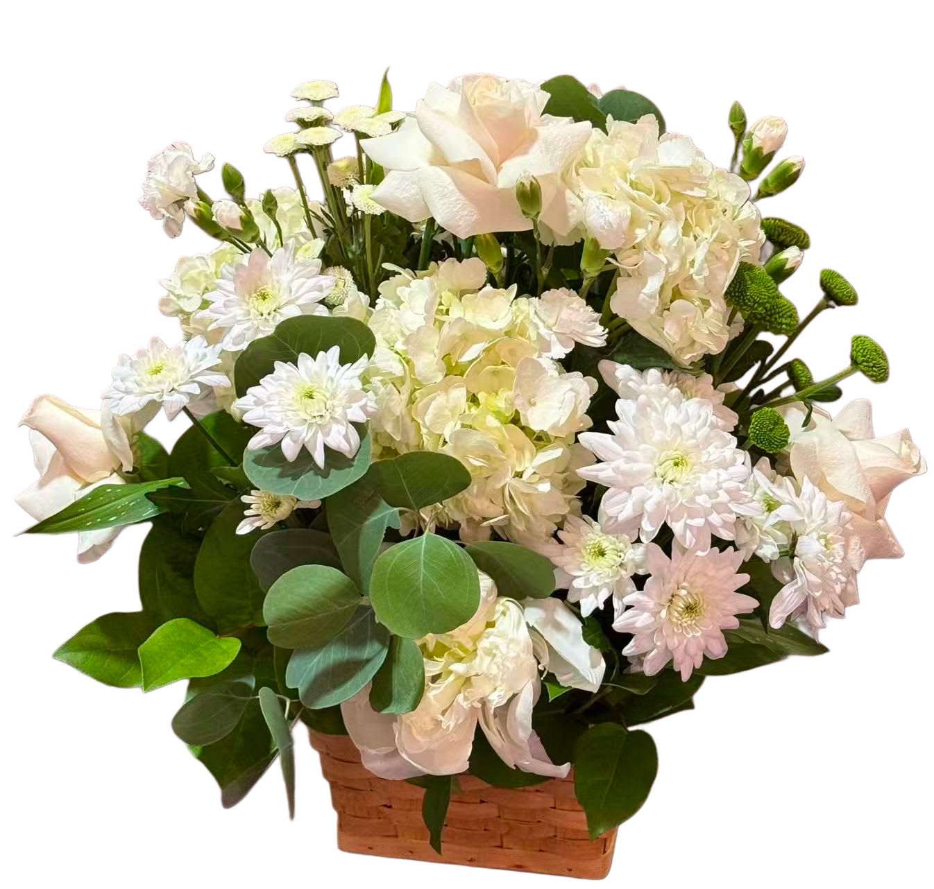 White and pale pink flowers arranged in a woven basket