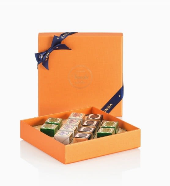 Orange gift box filled with assorted chocolates