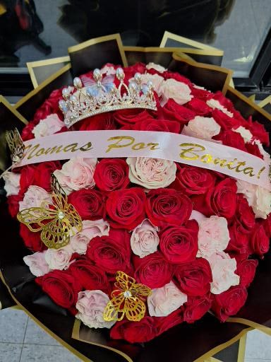 Bouquet of red and white roses with a crown and ribbon