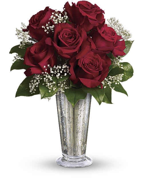 Red roses arranged in a silver vase with baby's breath