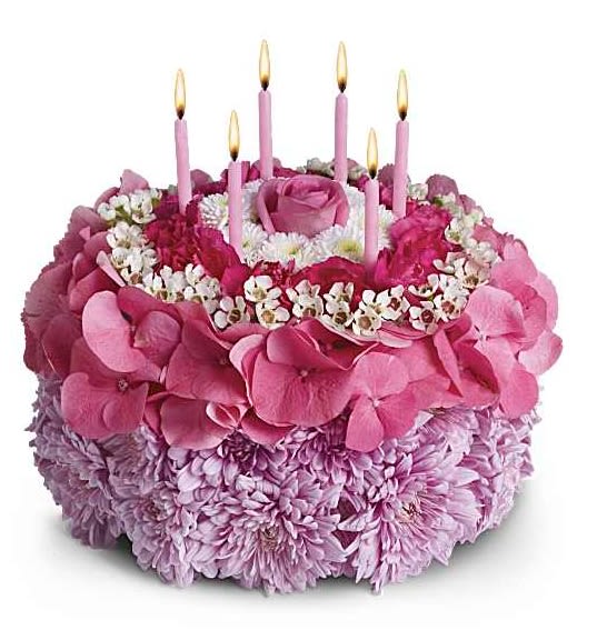 Your Special Day - Make a wish! Instead of a calorie-packed cake, send the birthday star a birthday cake of flowers. This unique arrangement features happy shades of pink, purple and white. And no birthday cake's complete without candles! This cake-inspired floral arrangement is not intended for consumption. Pleasing lavender cushion mums, pink hydrangea, white waxflower and button mums are sculpted into a round flower cake that's topped with six birthday candles. Orientation: All-Around